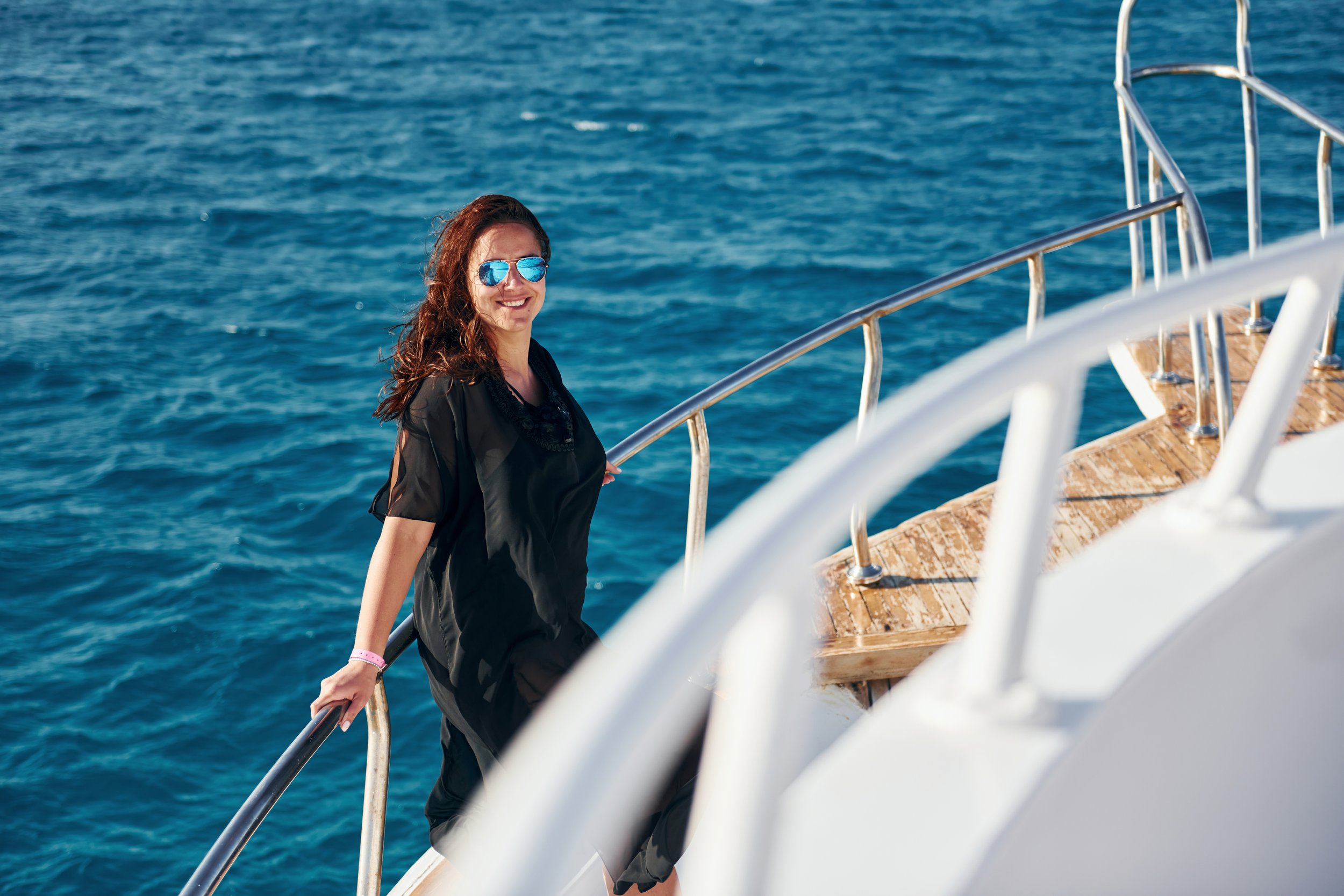 mature-woman-standing-on-the-yacht-and-enjoying-he-2023-11-27-05-20-04-utc.jpg
