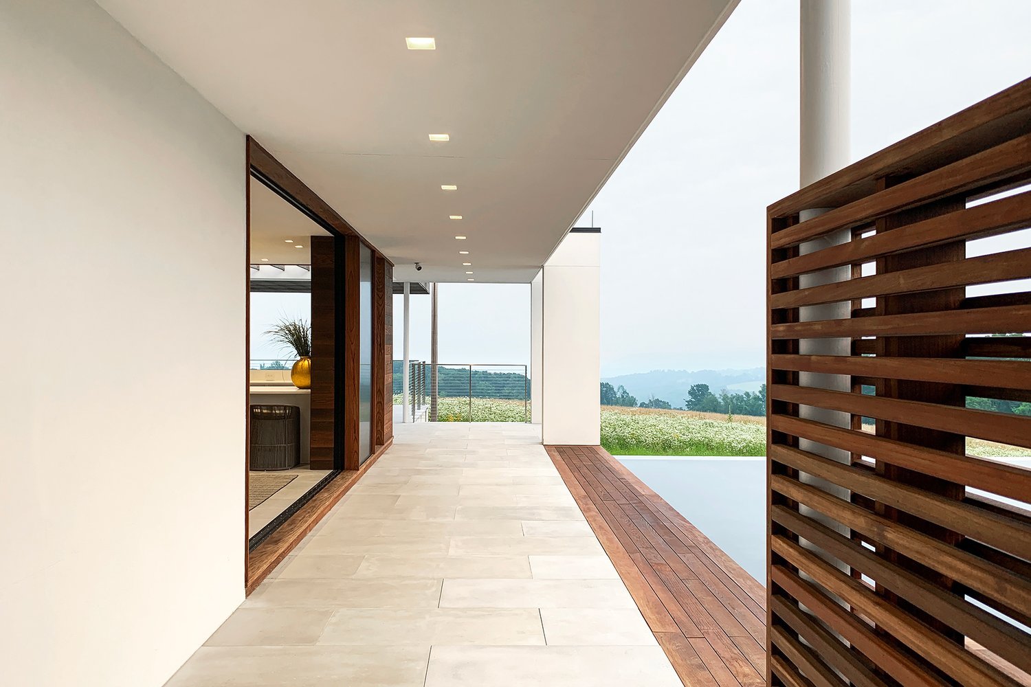 73_res4-resolution-4-architecture-millbrook-residence-modern-home-new-york-hudson-valley-custom-high-end-residential-pool-house-infinity-pool-wood-slats.jpg