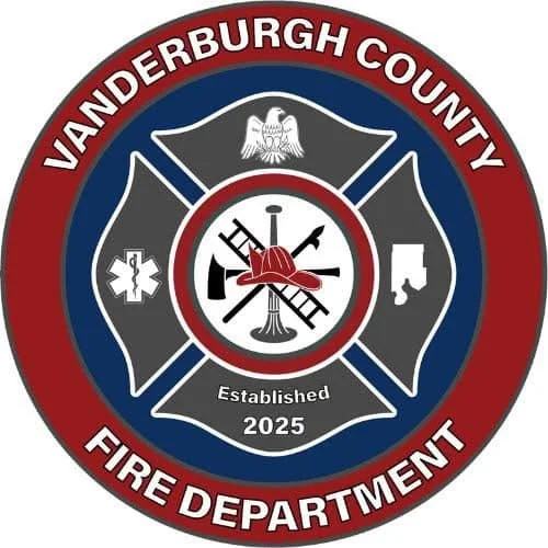Vanderburgh County Fire Department emblem featuring a shield with crossed axes, a fire hydrant, and a medical star of life, surrounded by a red and blue circular border with the department's name and establishment year 2025.