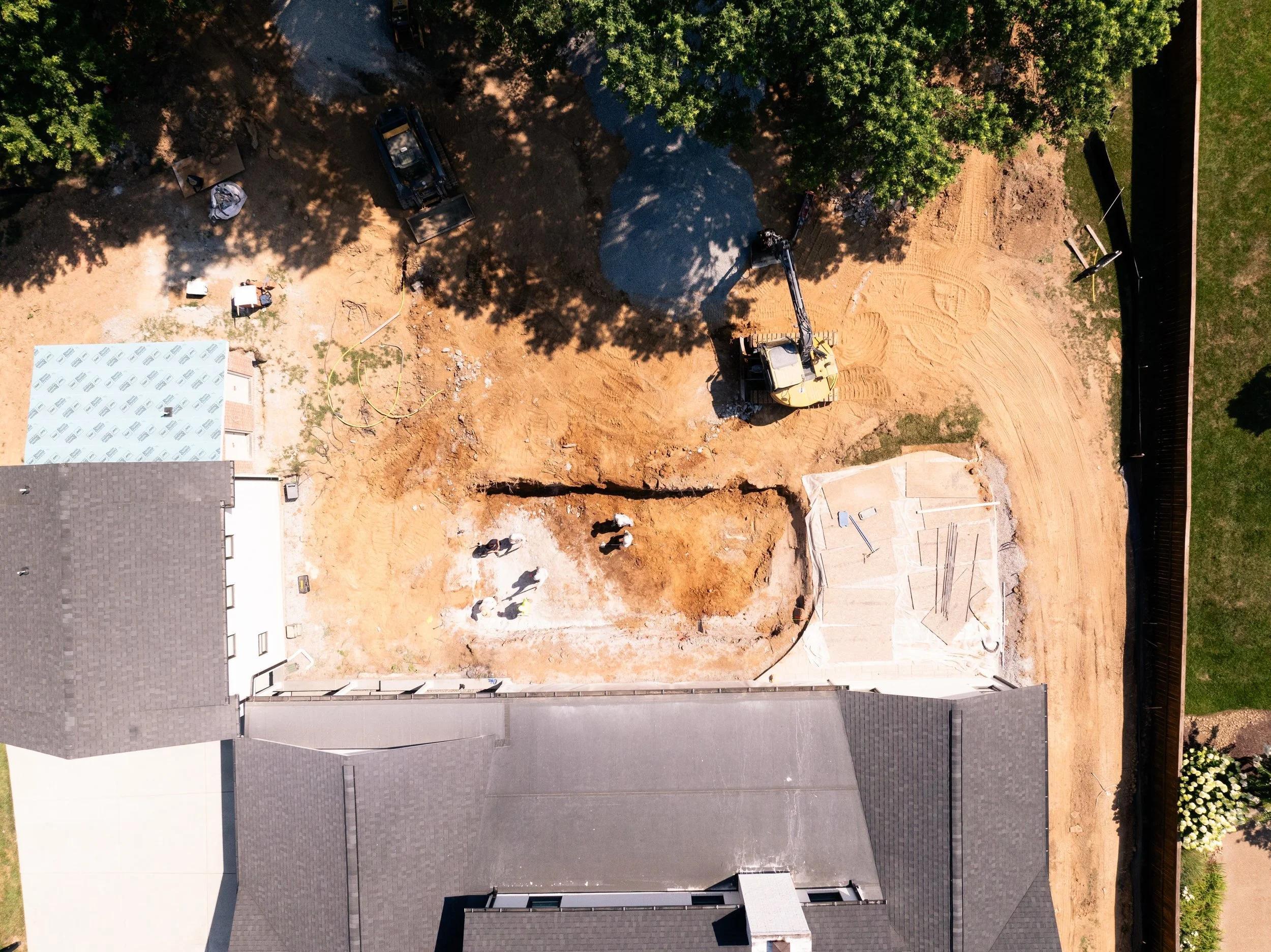The heat won't slow us down. While the temperatures rise, we're still out here building backyards that families can cool down in. Another custom pool is underway, and we're one step closer to bringing this outdoor living space to life.