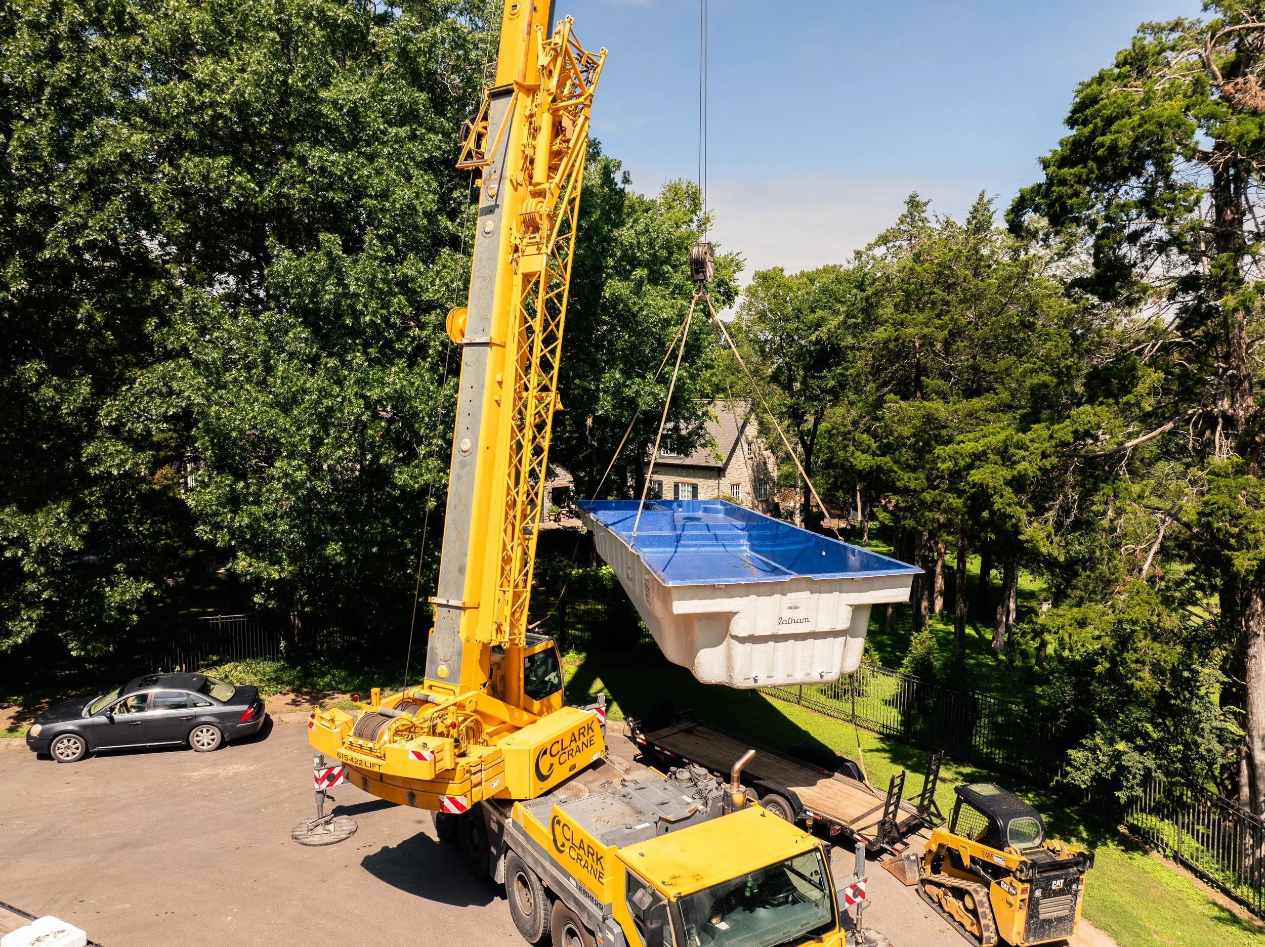 There's a lot more behind a pool install than most people see. This fiberglass shell is carefully lifted and positioned by a skilled team to ensure it's set exactly where it needs to be. That's teamwork in action. 💪