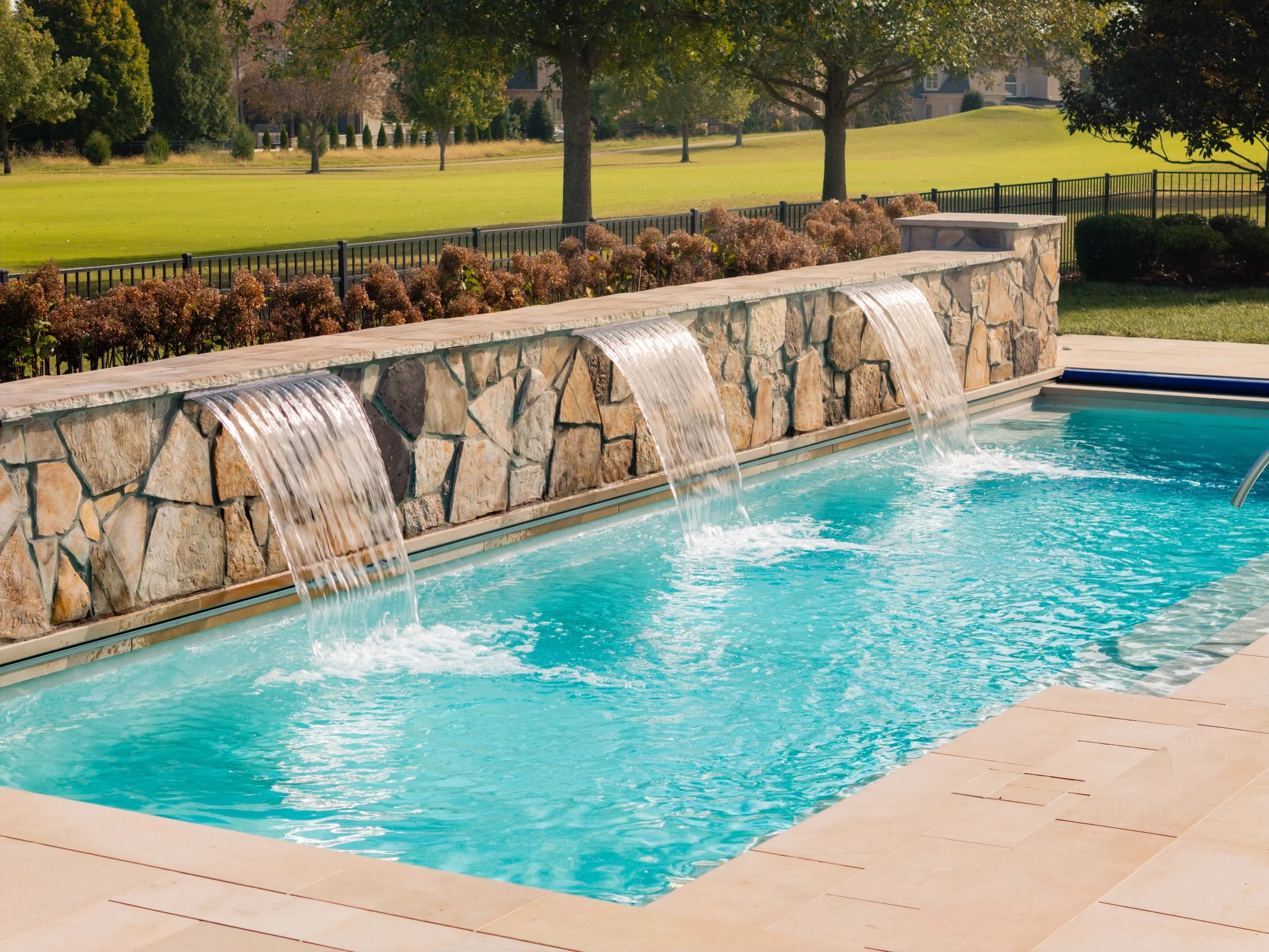 A pool is more than just water&mdash;it's an experience. Water features like waterfalls, sheer descents, bubblers, and deck jets add movement, soothing sound, and visual interest that take your backyard to the next level. They can create a relaxing a