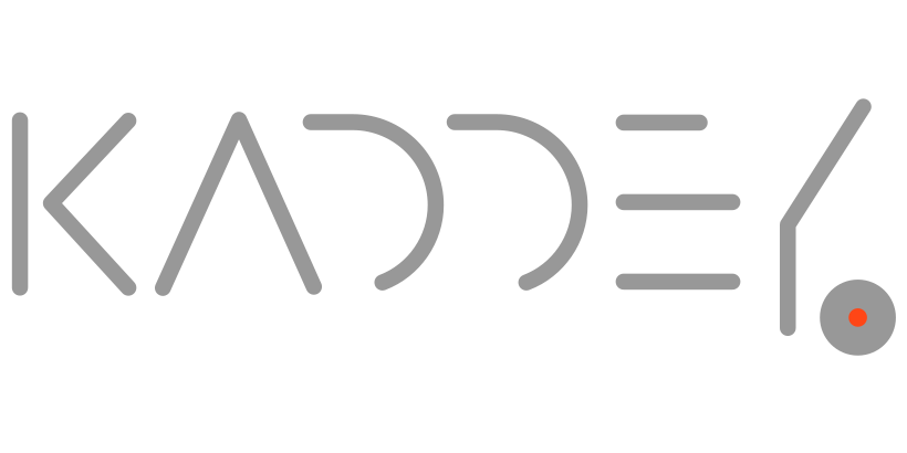 Stylized text spelling 'KAOS' with a small gray circle containing a red dot at the end