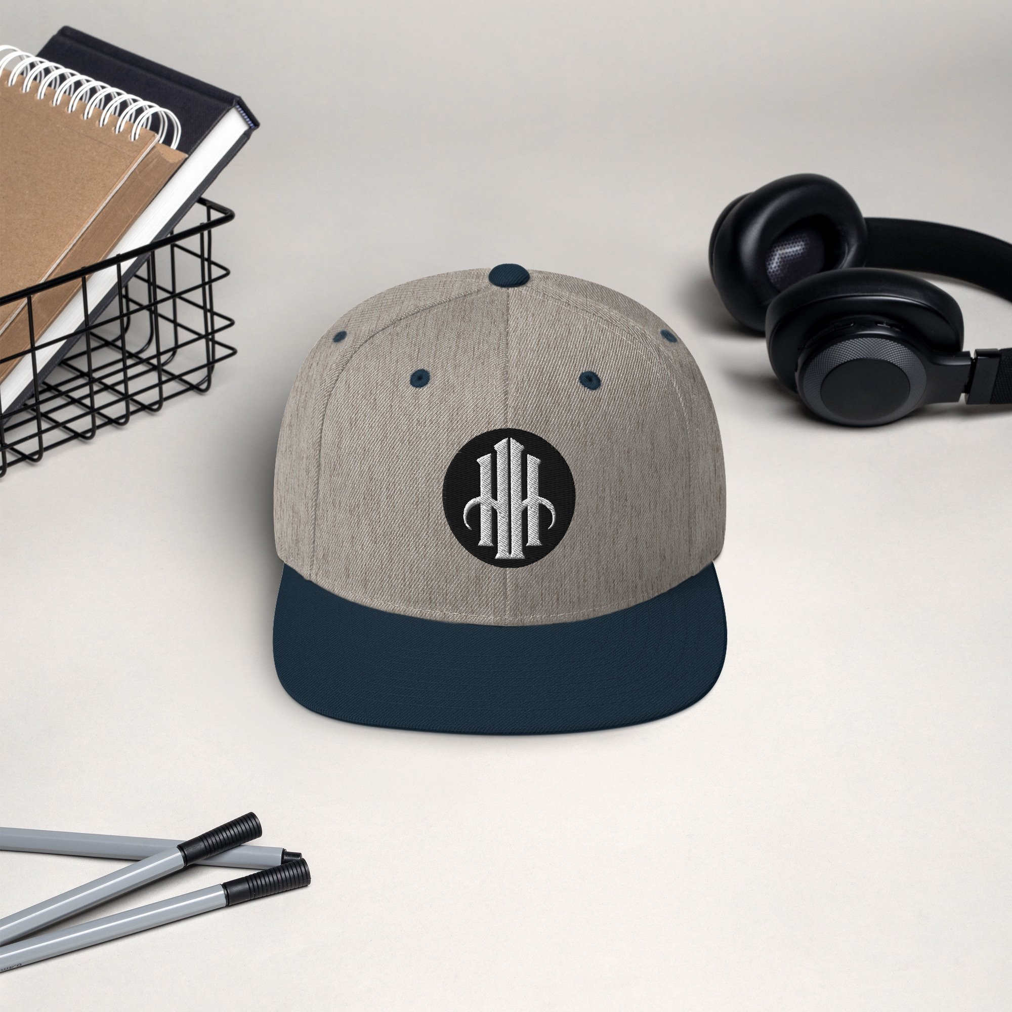 classic-snapback-heather-grey-navy-front-65ec891498041.jpg