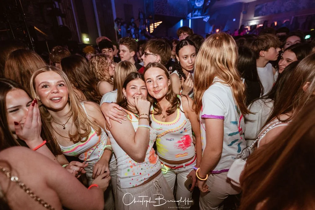 A large group of young people partying, laughing, and having fun.