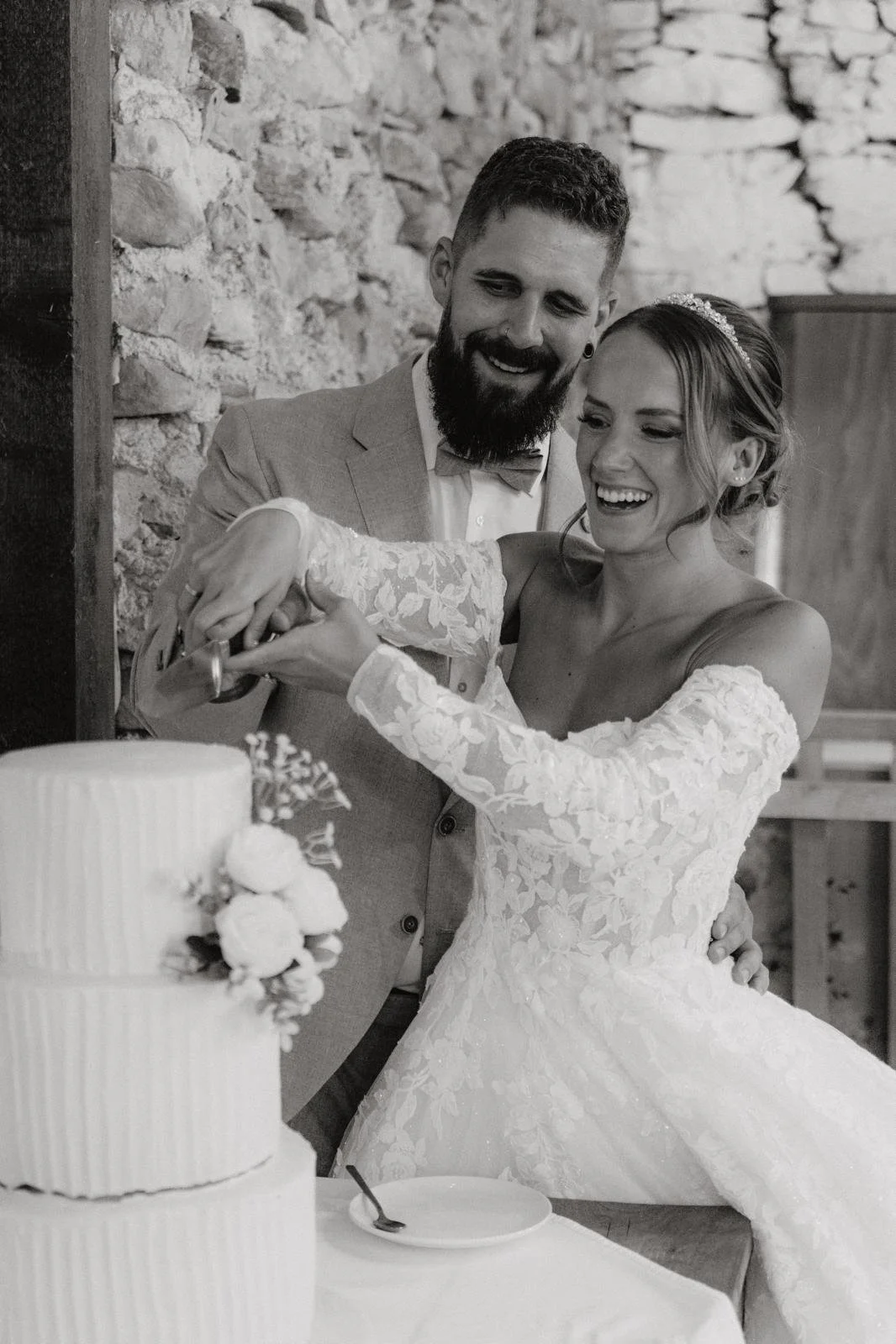 happy couple cutting a wedding cake