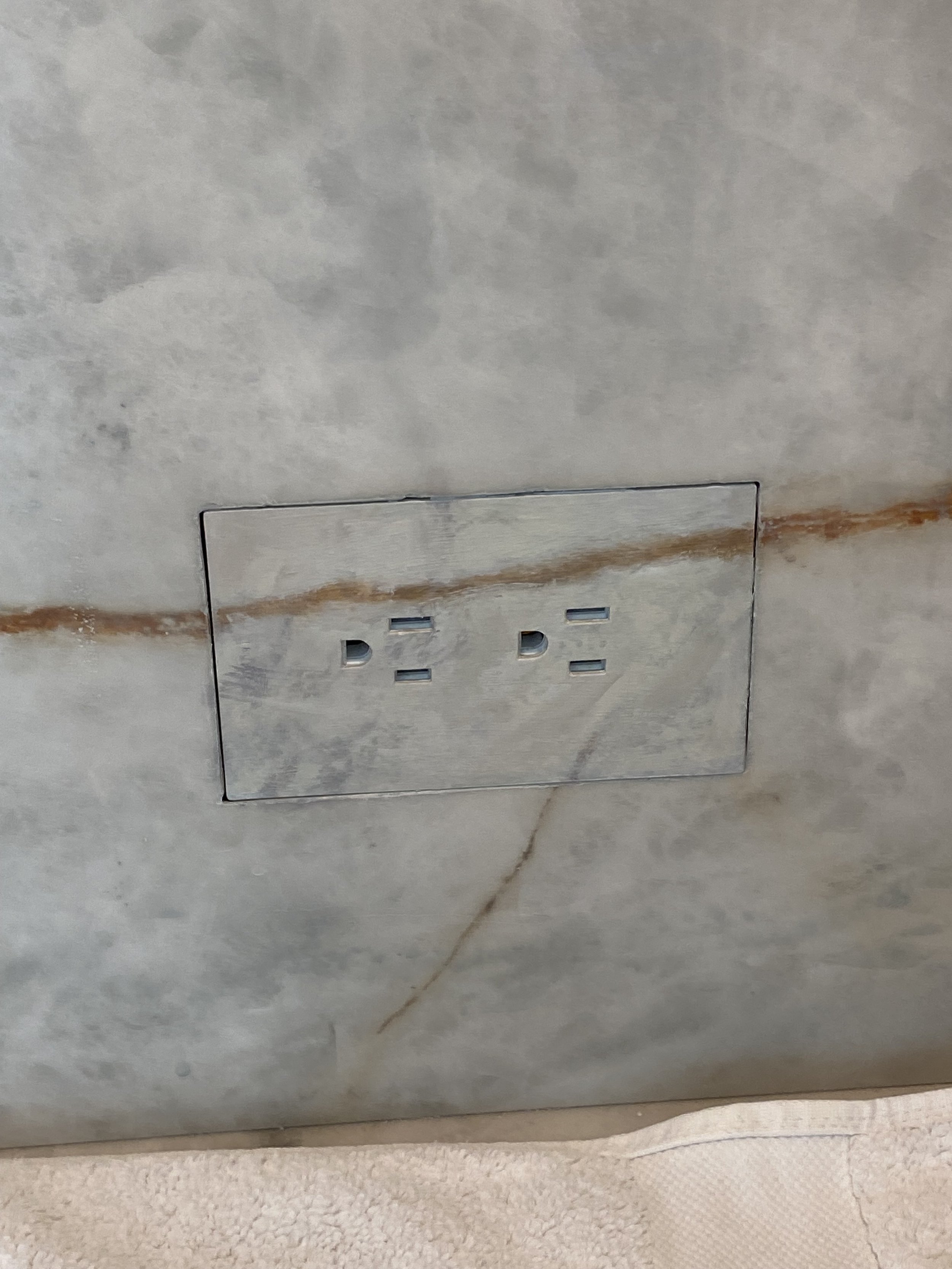 Switch plate on marble wall