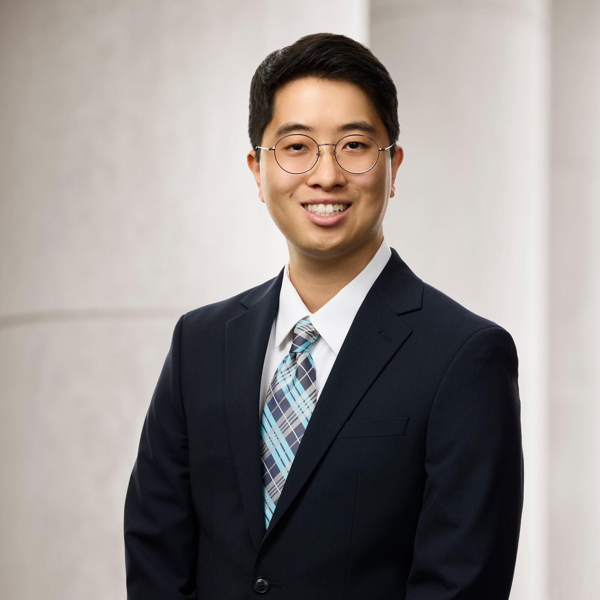 Portrait of Andrew Lee, Legal Analyst at Baughman Kroup Bosse, on courthouse steps.