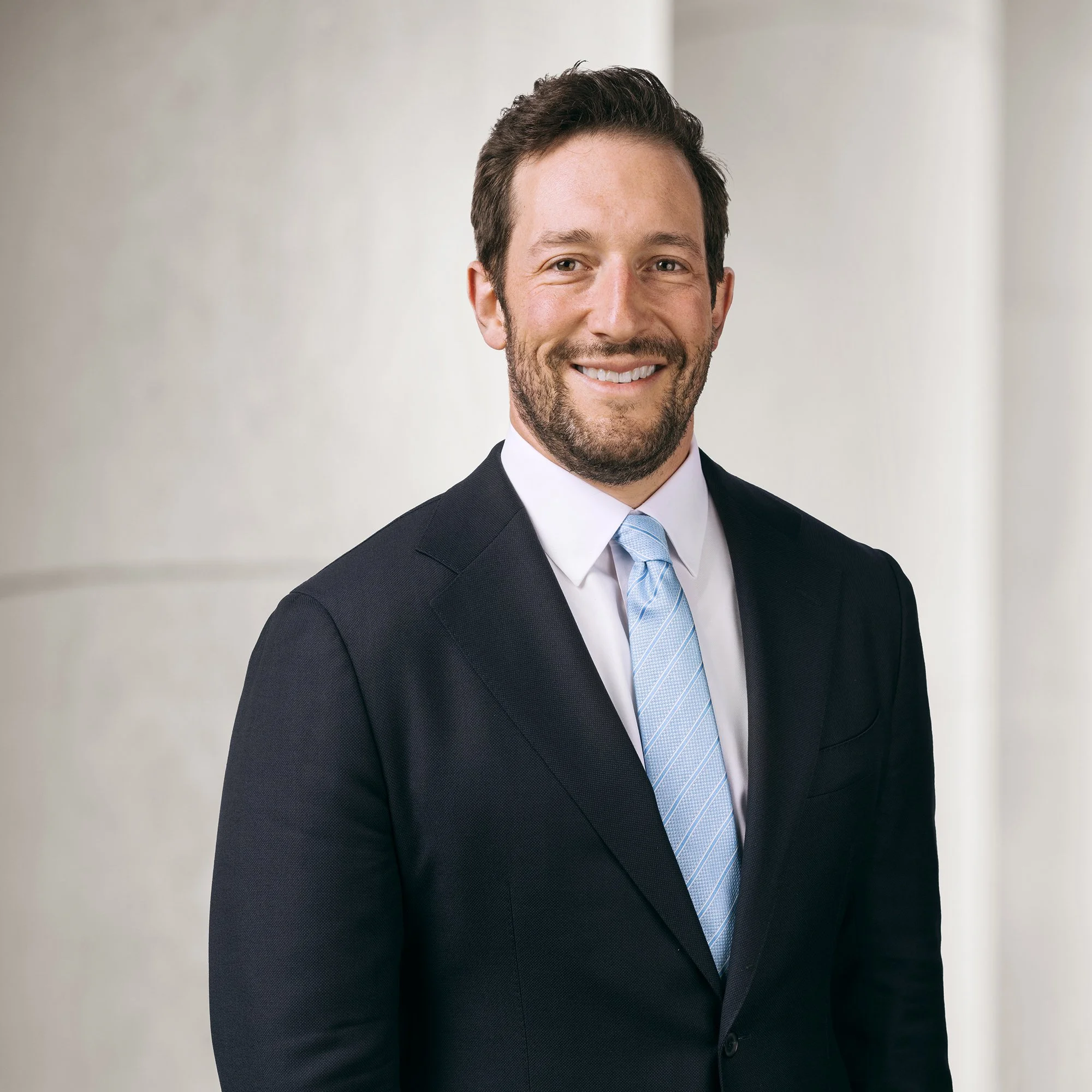 Portrait of Daniel A. Schwartz, partner at Baughman Kroup Bosse, on courthouse steps.