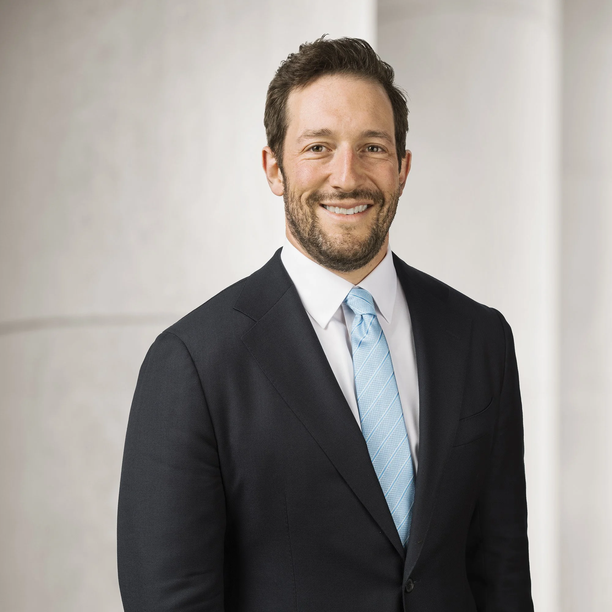 Portrait of Daniel A. Schwartz, partner at Baughman Kroup Bosse, on courthouse steps. 