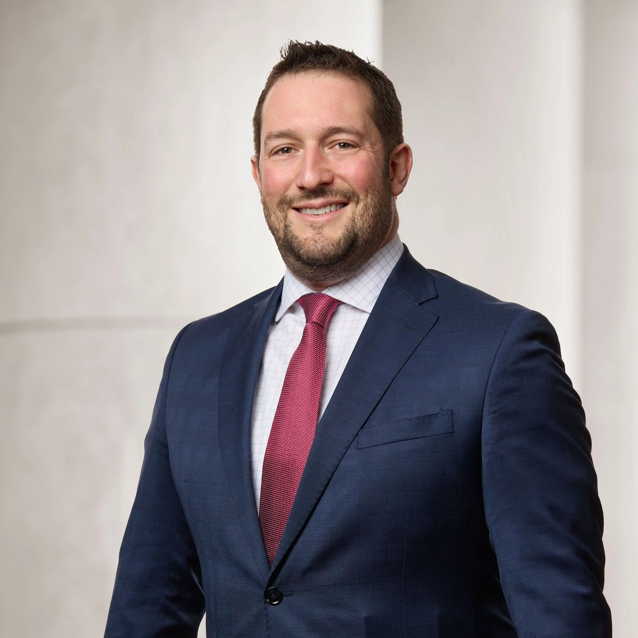 Portrait of Daniel A. Schwartz, partner at Baughman Kroup Bosse, on courthouse steps.