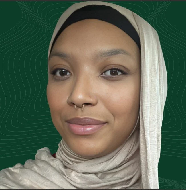 Close-up photo of a woman with light brown skin, wearing a black head covering and beige hijab, smiling softly against a green background with contour lines.