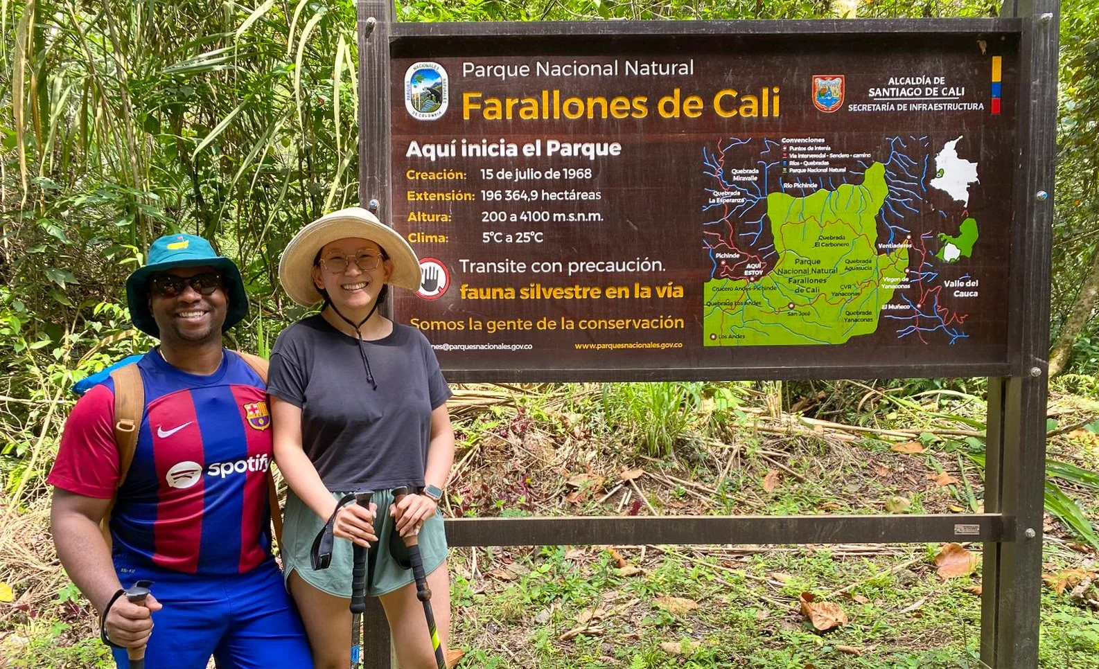 Two American tourists enjoying a guided hike in the breathtaking mountains of Parque Nacional Natural Farallones de Cali, exploring lush cloud forest trails just outside Cali, Colombia.