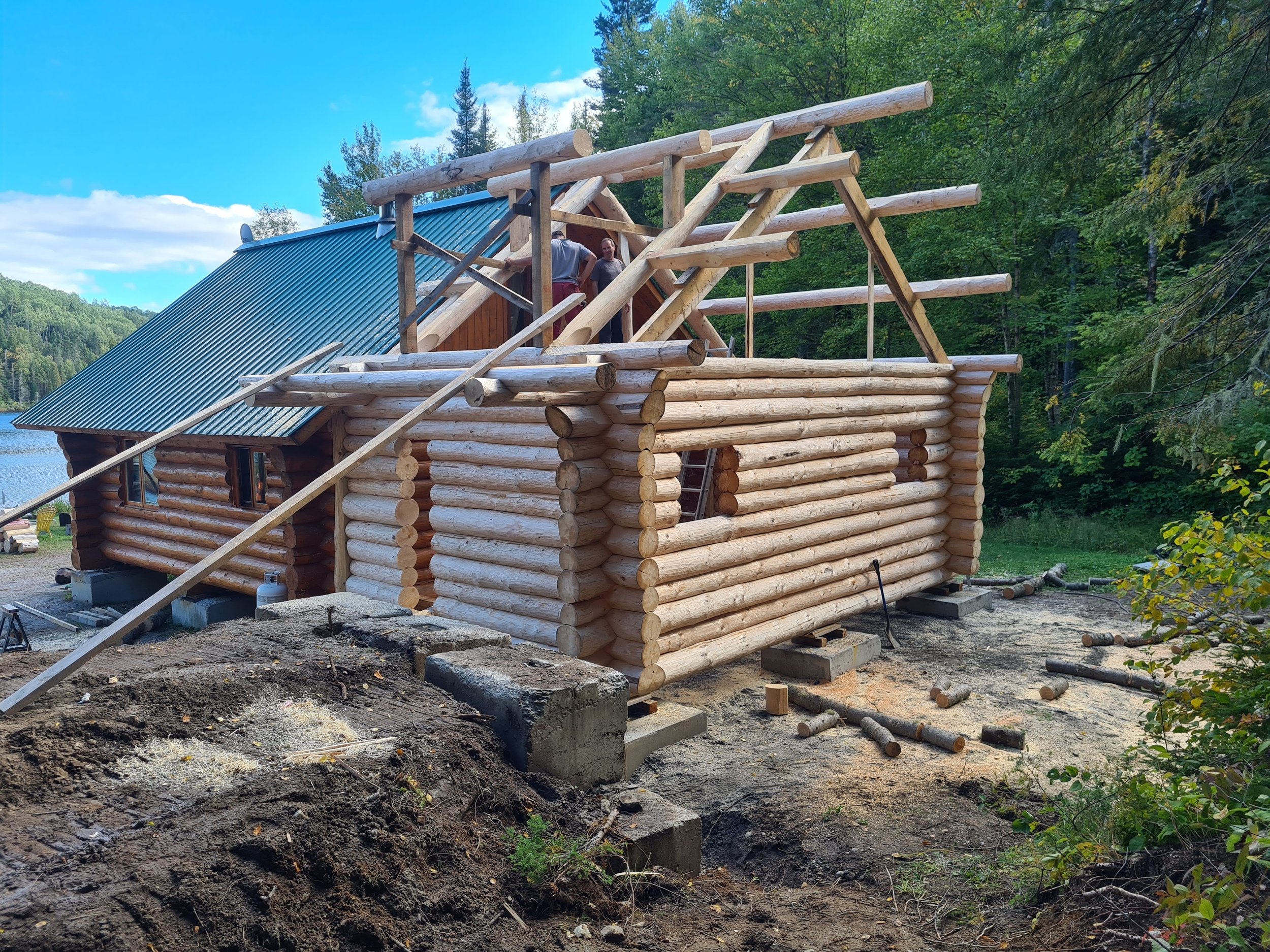 Log House extension while under Charpente Beaurivage