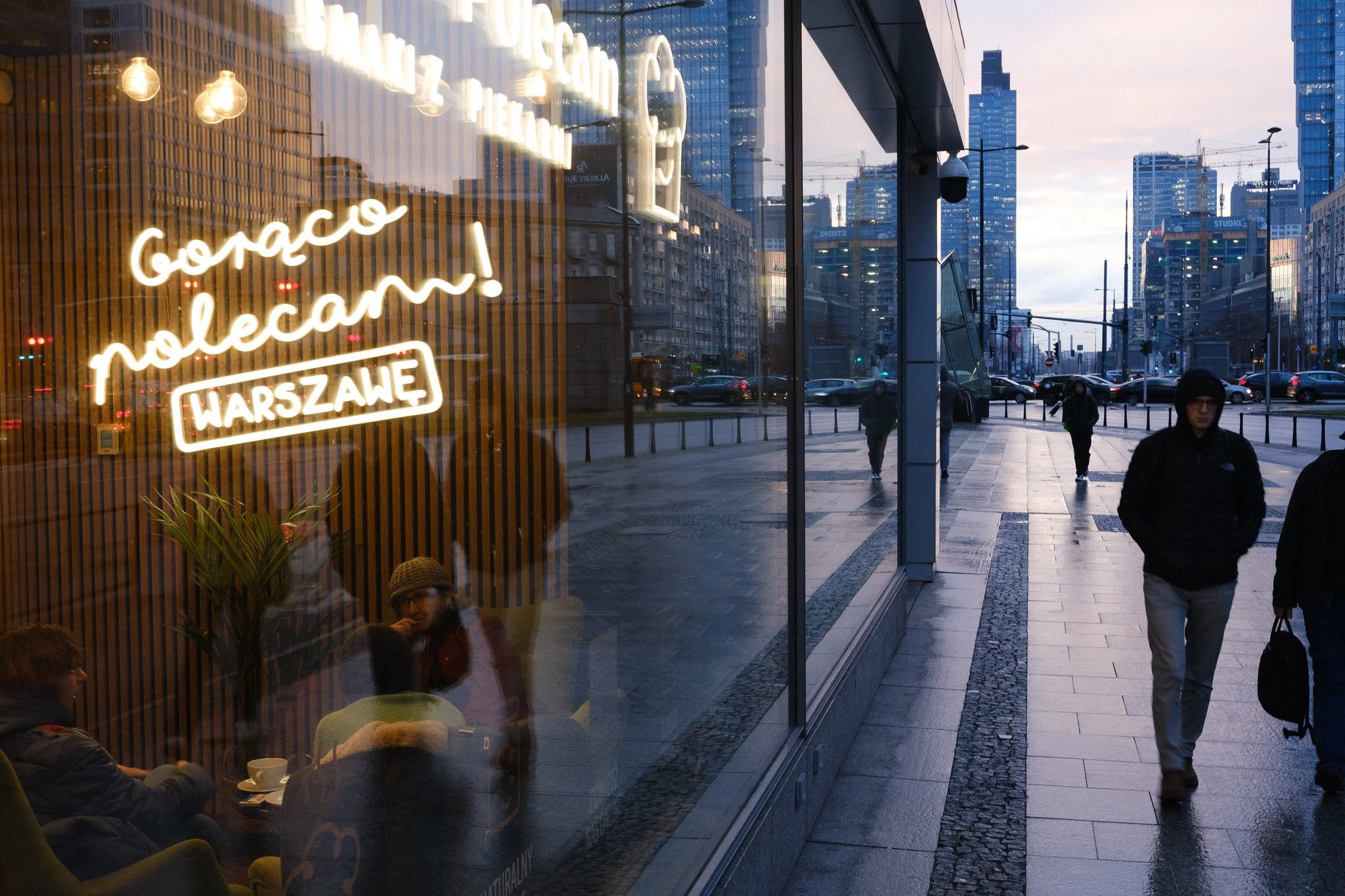 Street photo in Warsaw, Poland, showing modern architecture in the financial district.