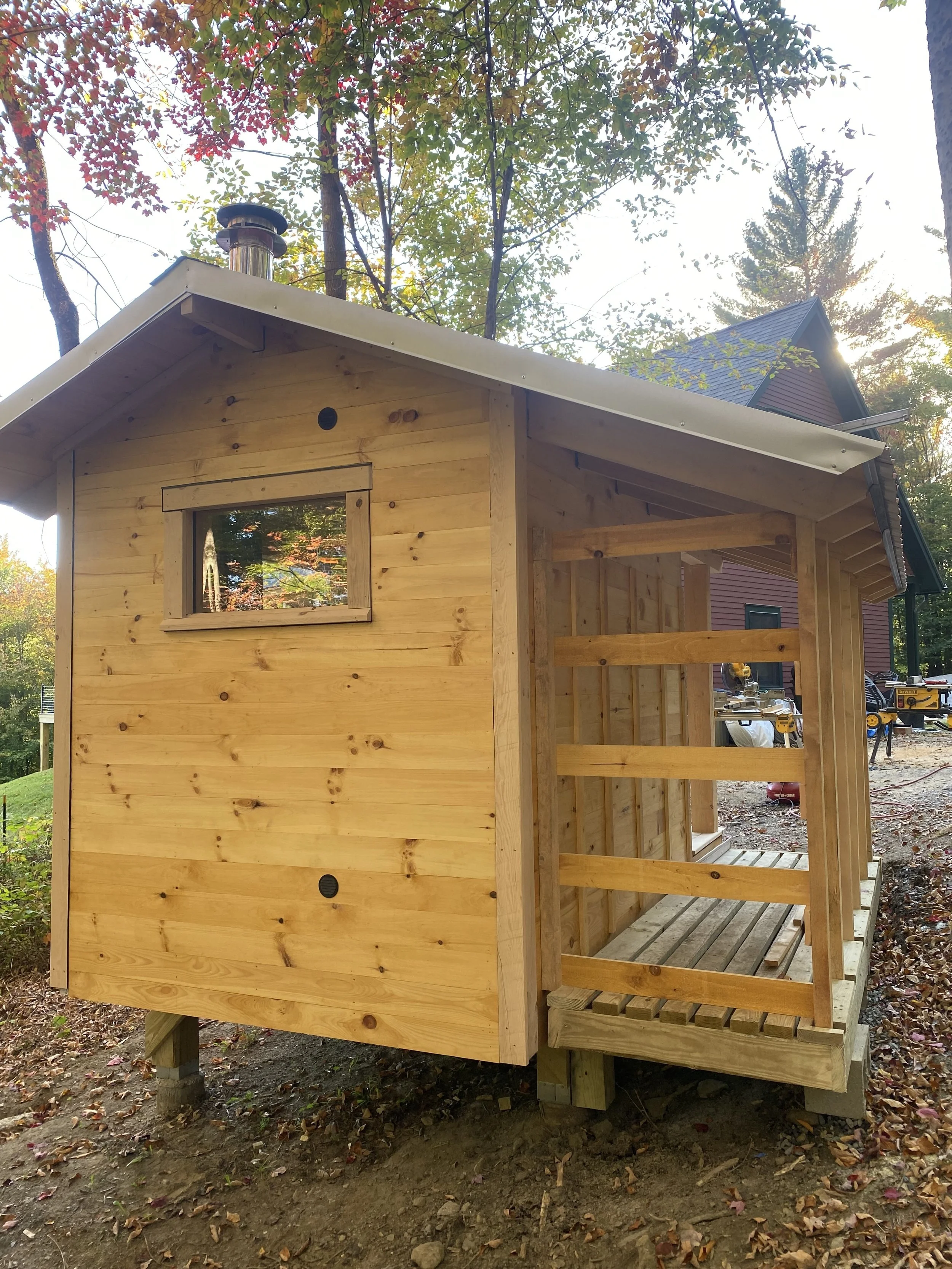 This custom sauna sits at the forest’s edge, built with rot-resistant Hemlock beams and serene valley views.