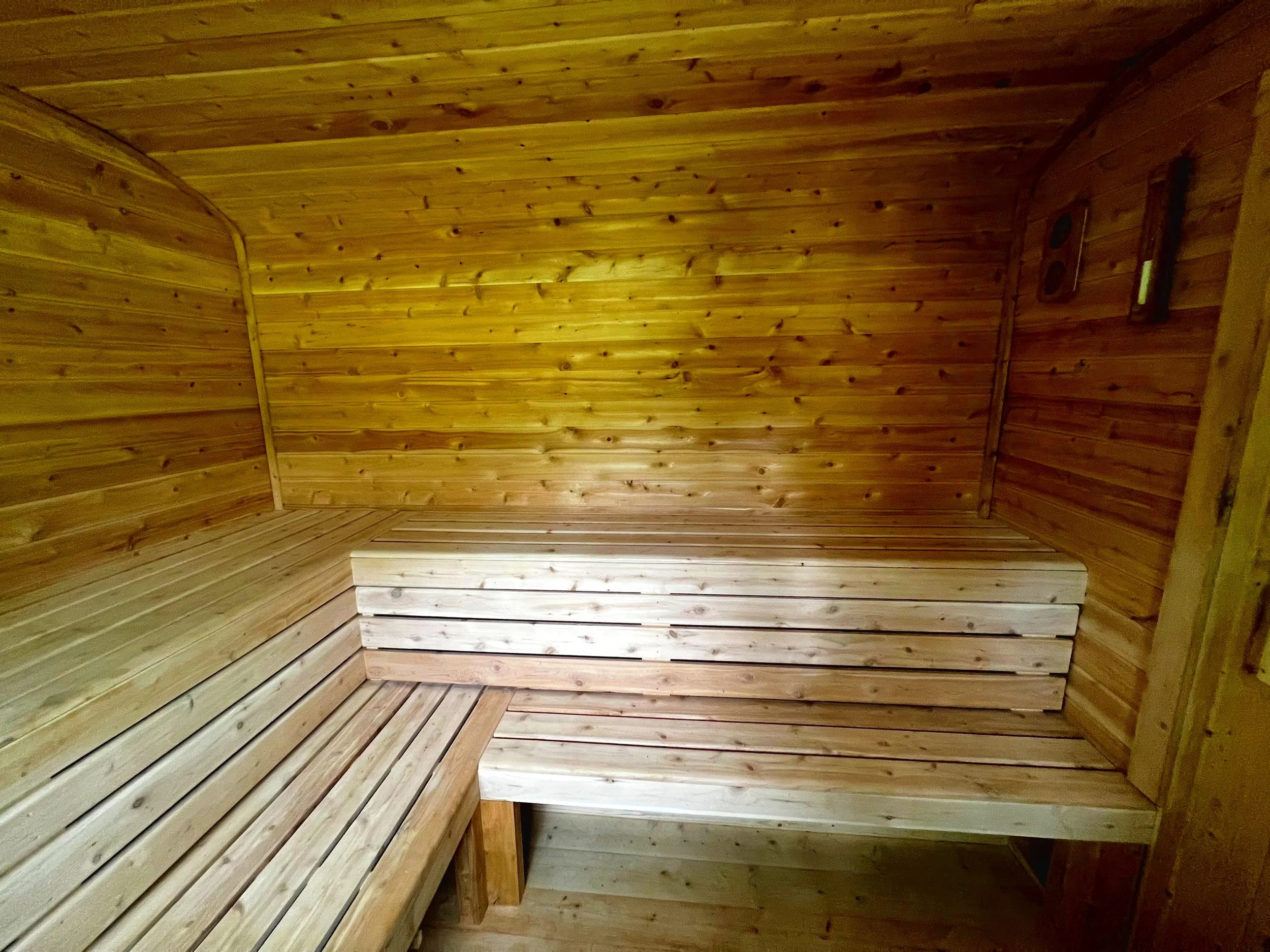 Every detail inside this sauna is intentional—from the joinery to the gentle curve of the bench seating.
