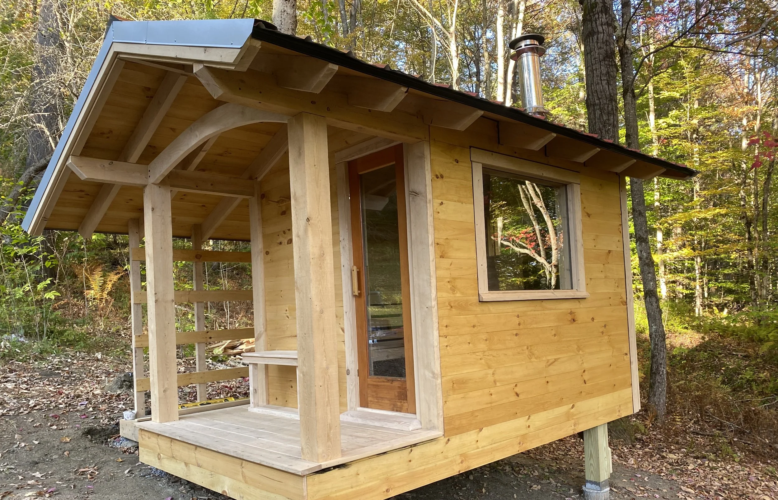 Our forest sauna features locally harvested Hemlock, a cedar bench layout, and a built-in shed for wood storage.
