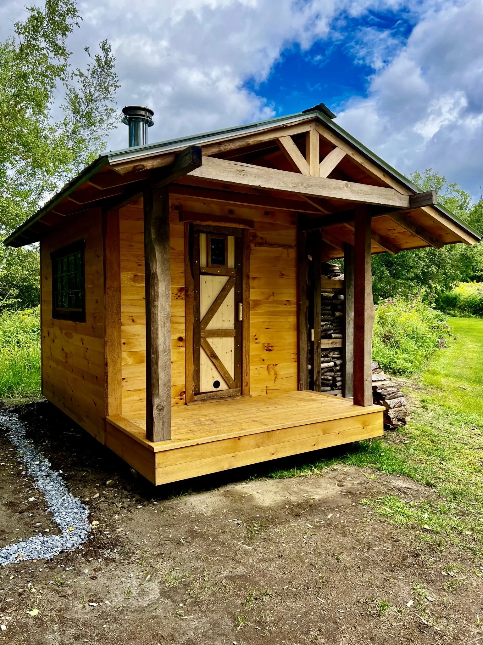 Built with 175-year-old reclaimed barn wood, this custom sauna combines rustic timbers with smooth shiplap for a warm, timeless design.