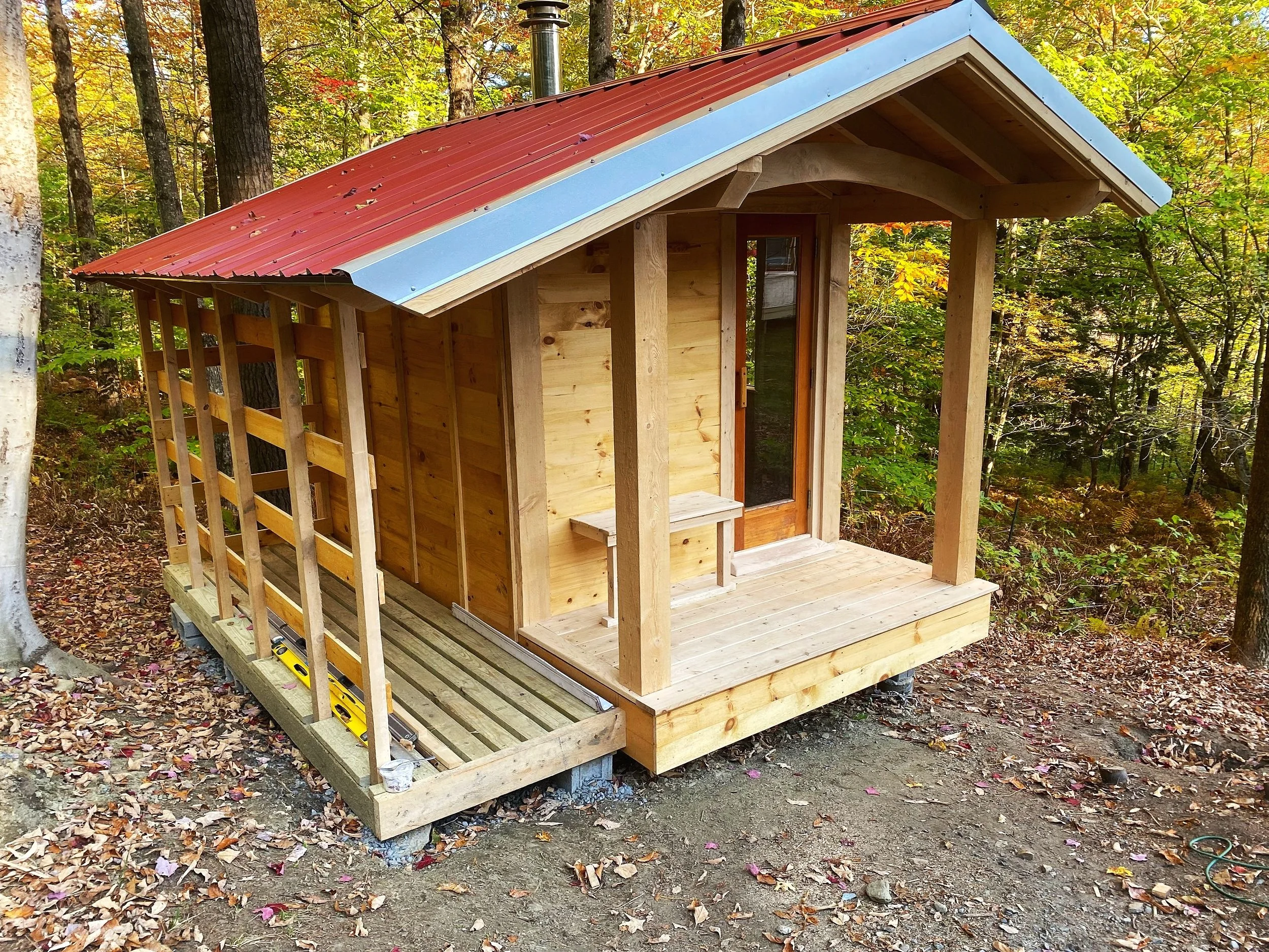 Edge-of-forest sauna with panoramic views of the Mad River Valley, crafted from native Hemlock and cedar.