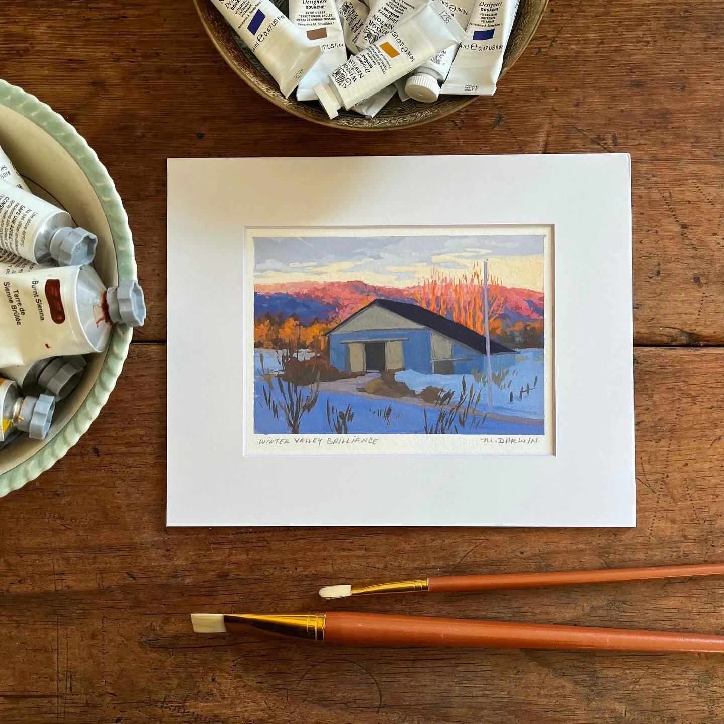 This blue barn was our next door neighbour when we lived in the Annapolis Valley. ☀️ Here, sunlight illuminated bare winter trees and turned the North Mountain hillside into a fiery mass of orange and pink. I found the contrast of the sunlit trees wi