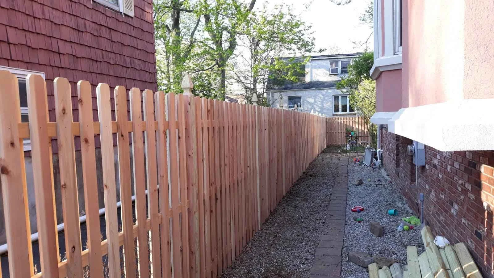 Classic Wood Fence Installation: Elevate your property's charm with Empire Fence's timeless craftsmanship.