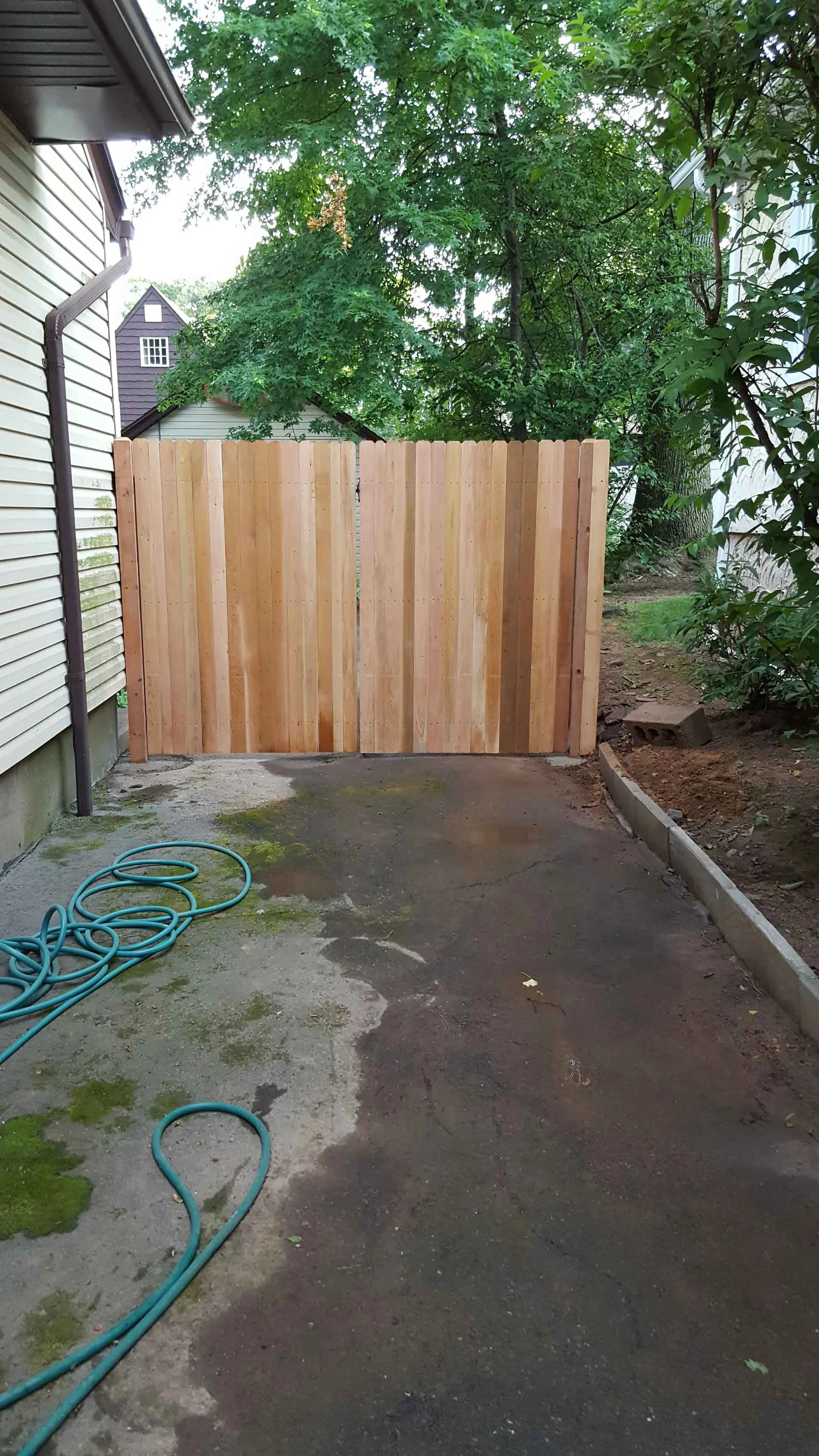 Versatile Wood Fence Style: Enhance any property with the natural appeal of wood, expertly installed by Empire Fence.