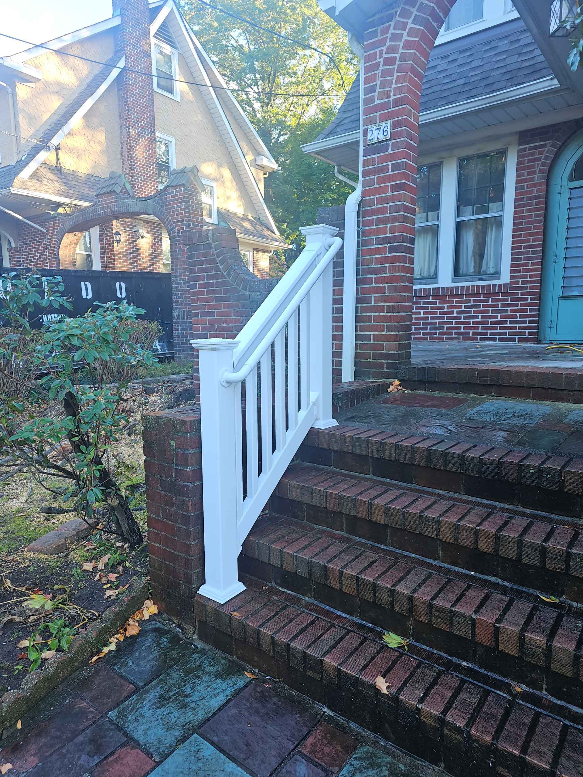 Enchanting Vinyl Entrance: Experience the magic as Empire Fence transforms your home's entry with low-height vinyl allure.