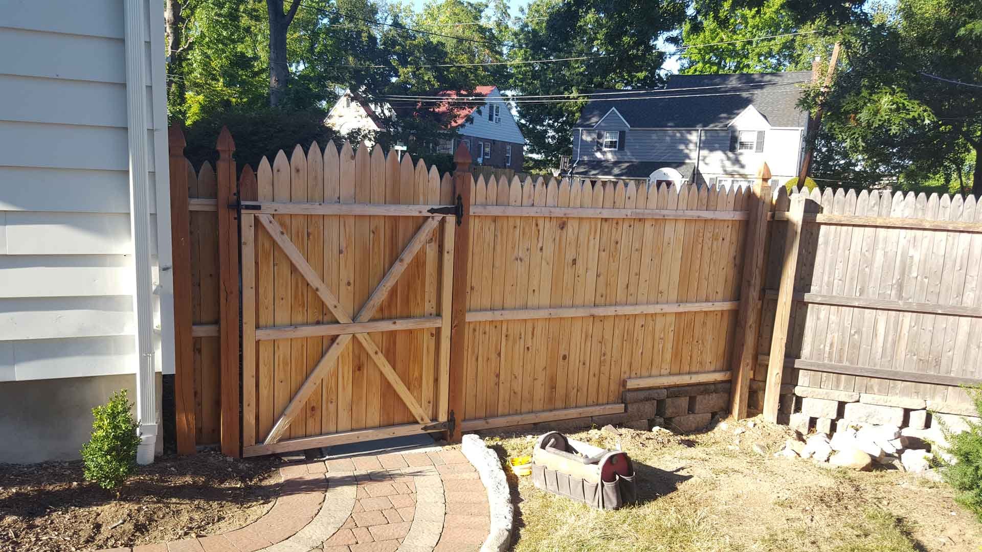 Secure Boundaries Wood Fence: Empire Fence delivers security and style with a robust wood fence installation.