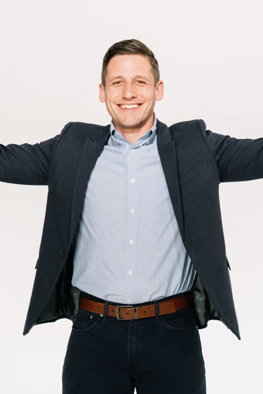 Jimmy Williams - Co-founder of 6th Ave Homes - both arm wide open - welcoming all