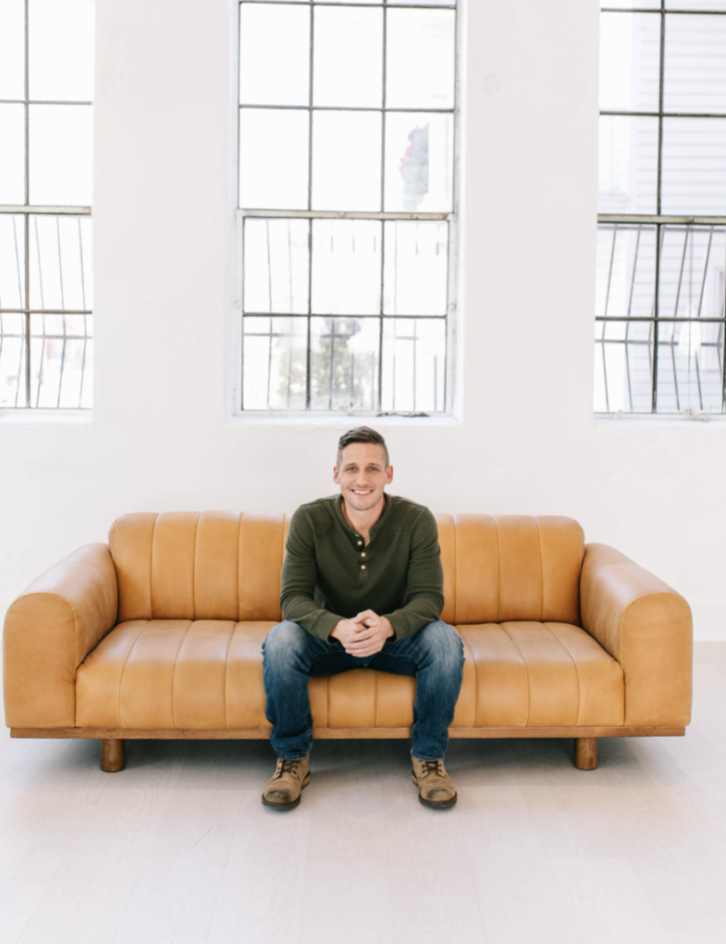 Jimmy Williams - Co-founder of 6th Ave Homes - Sitting on sofa