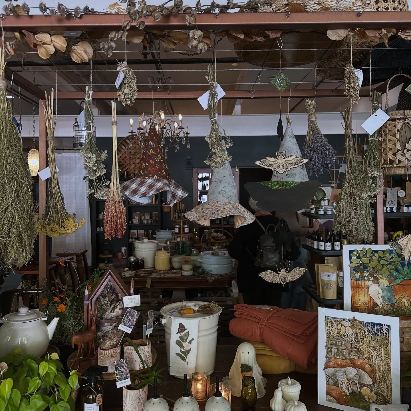 I am so excited to have many of my handmade items at @ginny.lous !! Love the hanging witch hats I sewed as you enter the lovely shop. A few woven blankets and table clothes too.  If you&rsquo;re in the area check it out!! Erin also has a lovely tea b