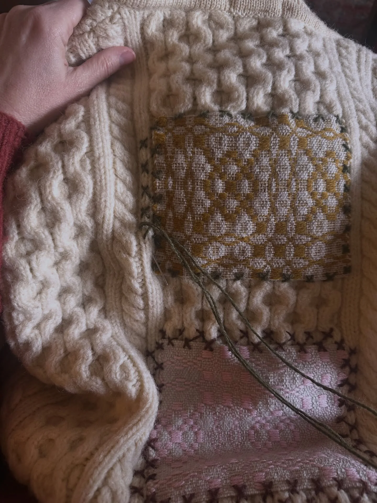 Embroidering woven patches onto the back of vintage cabled, Irish sweaters. I love how this one turned out with the decorative stitches and weaving my loves of textiles together. 

Lovely to wrap up in during the extreme cold weather we have had rece