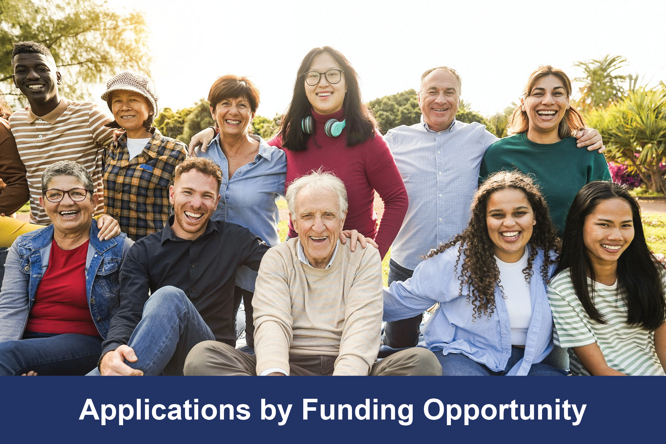 Group of multigenerational people smiling in front of camera - Multiracial friends of different ages having fun together - Main focus on asian center girl face