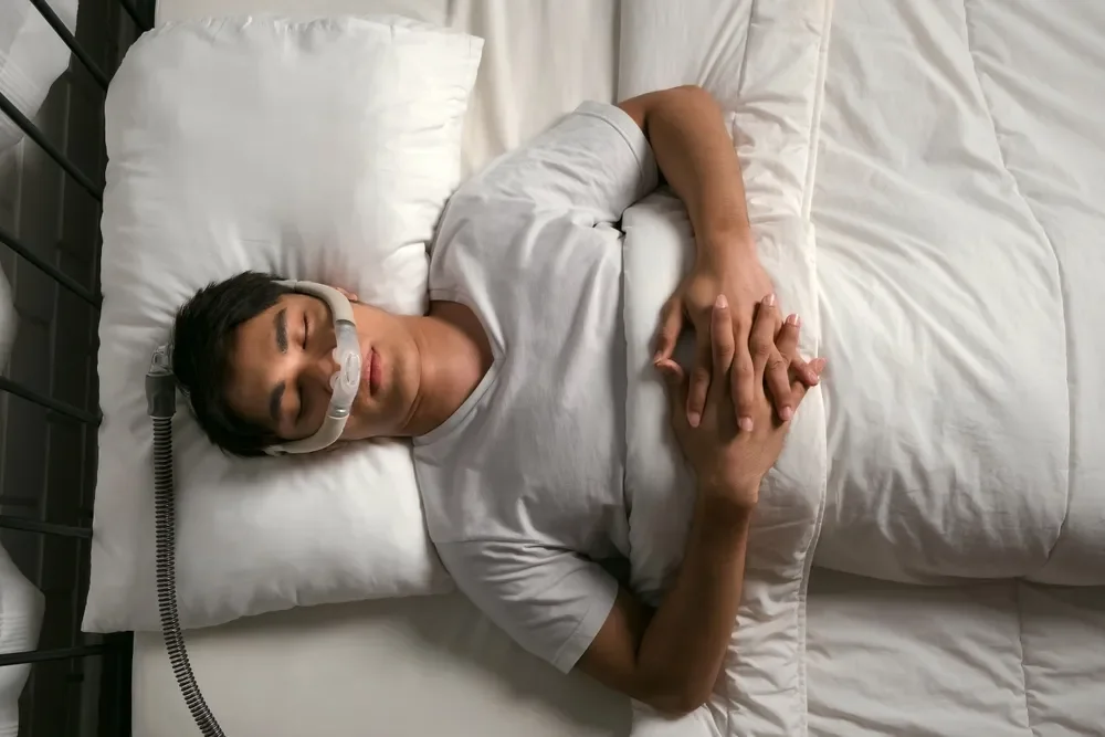A man using a CPAP for his sleep apnoea