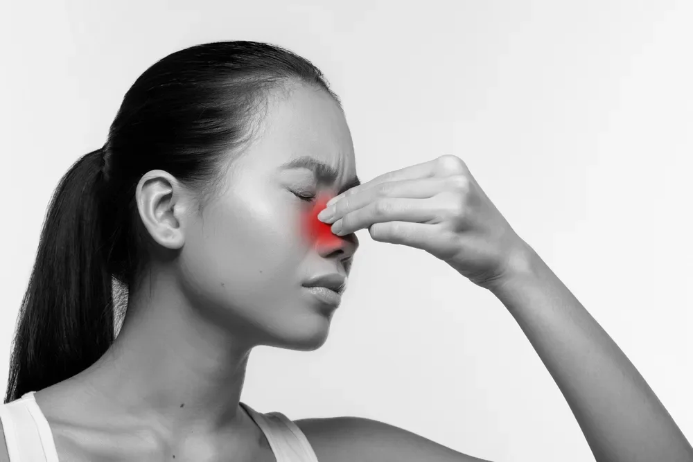 A woman experiencing chronic sinusitis