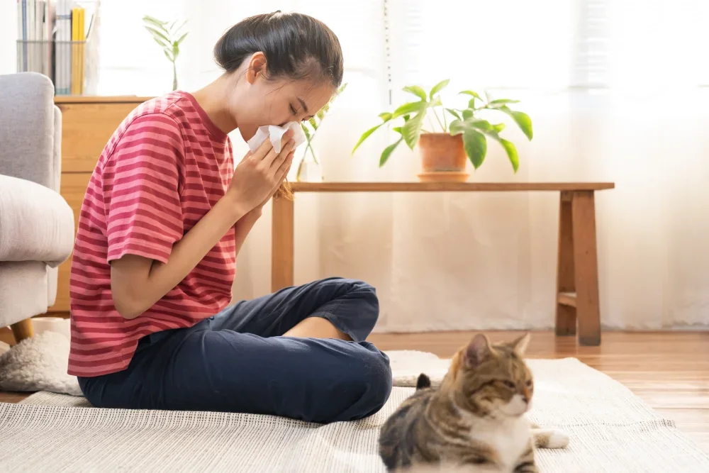 Woman with allergic rhinitis due to pet dander.