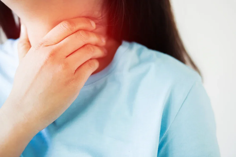 A woman experiencing repeated tonsillitis