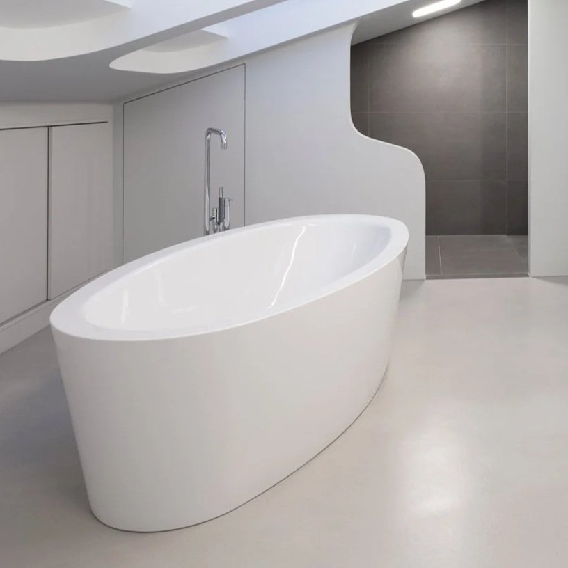 Modern bathroom with freestanding white bathtub and gray walls.
