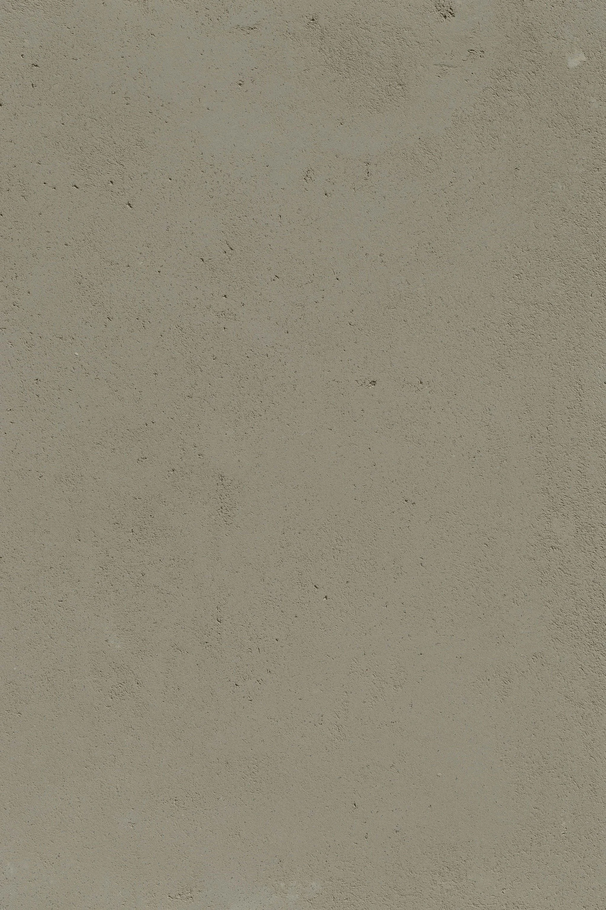 A plain, beige-colored textured wall.