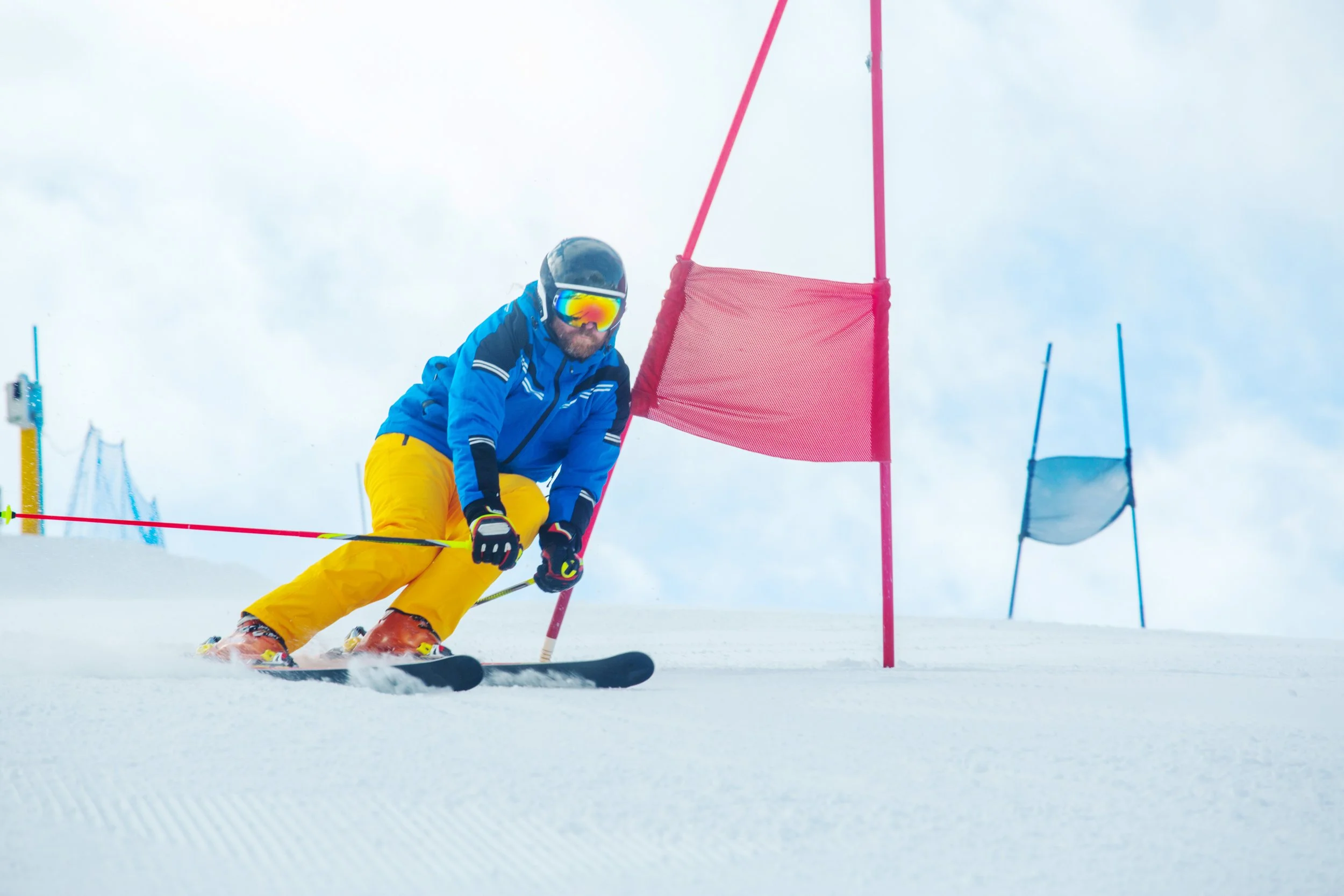 Skiers training in GS race gates during performance ski camp
