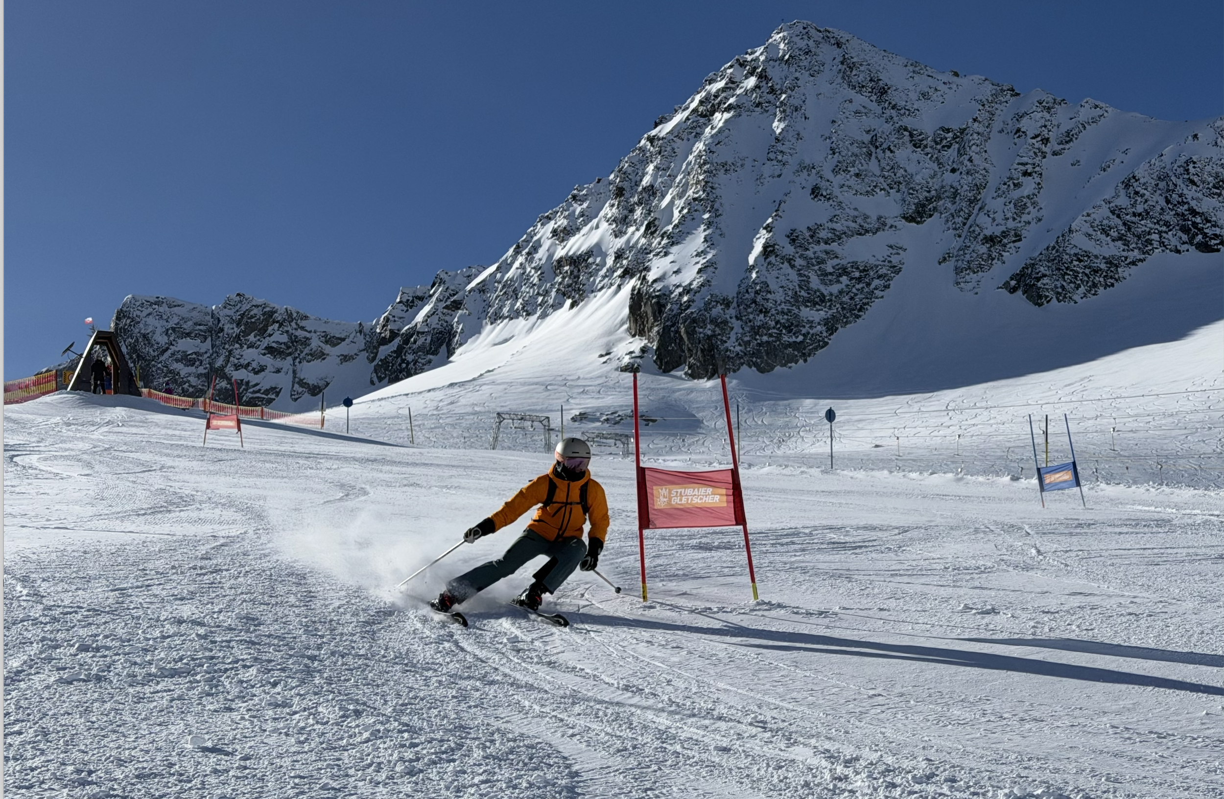 Adult ski racers practicing turns in a race training environment