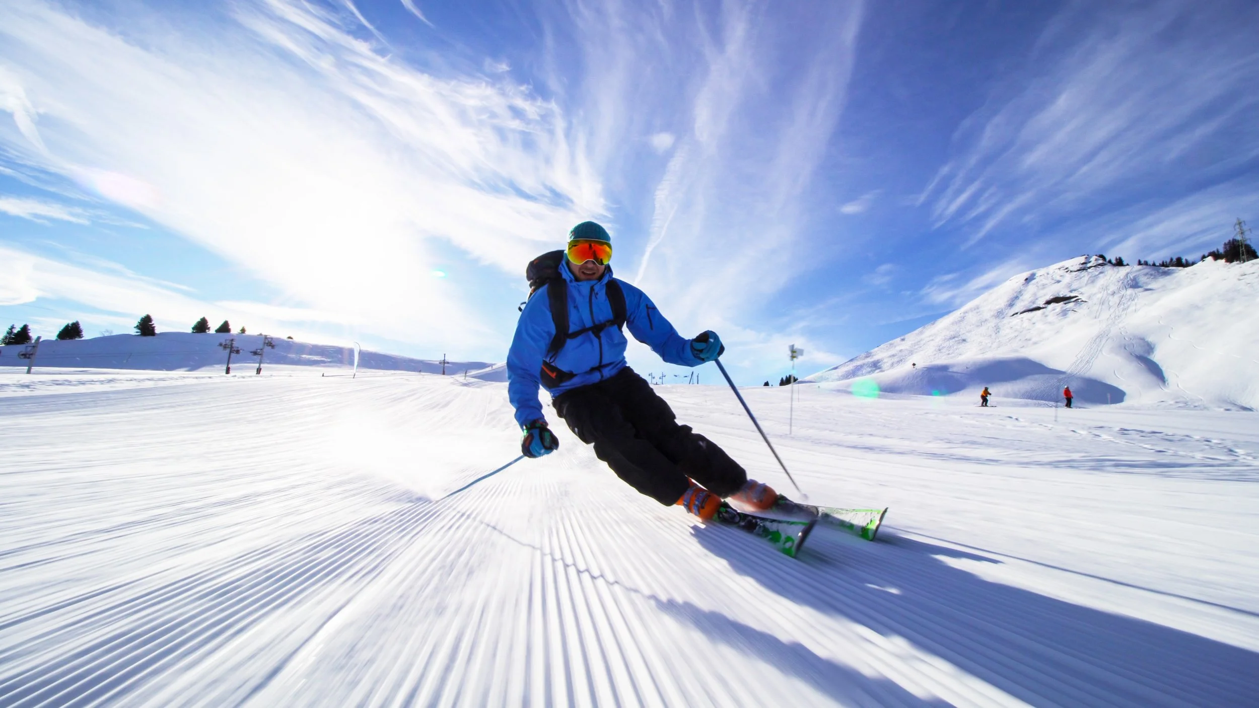 Adult skiers improving technique with professional coaching on piste