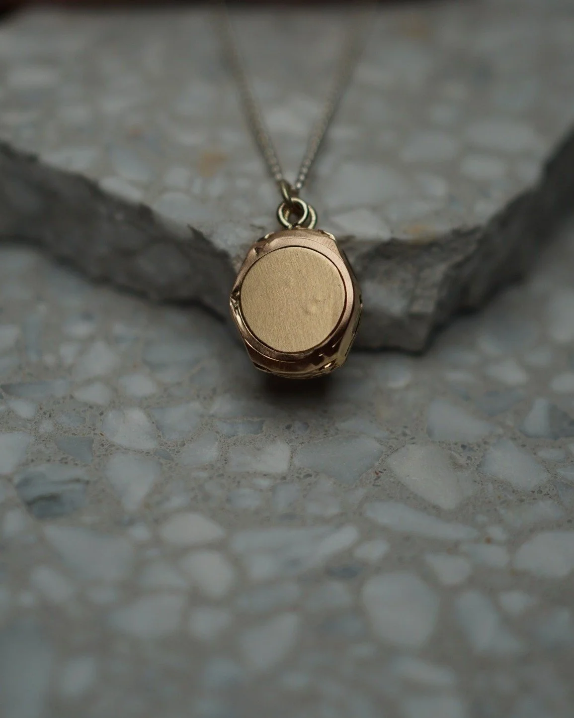 Any guesses for what this pendant hidden locket used to be? 
Or what kind of animal left its teef marks on the back....
Swipe for some clues of the before shot. 

To get to the finished wearable pendant, this 18kt yellow gold watch housing had some c
