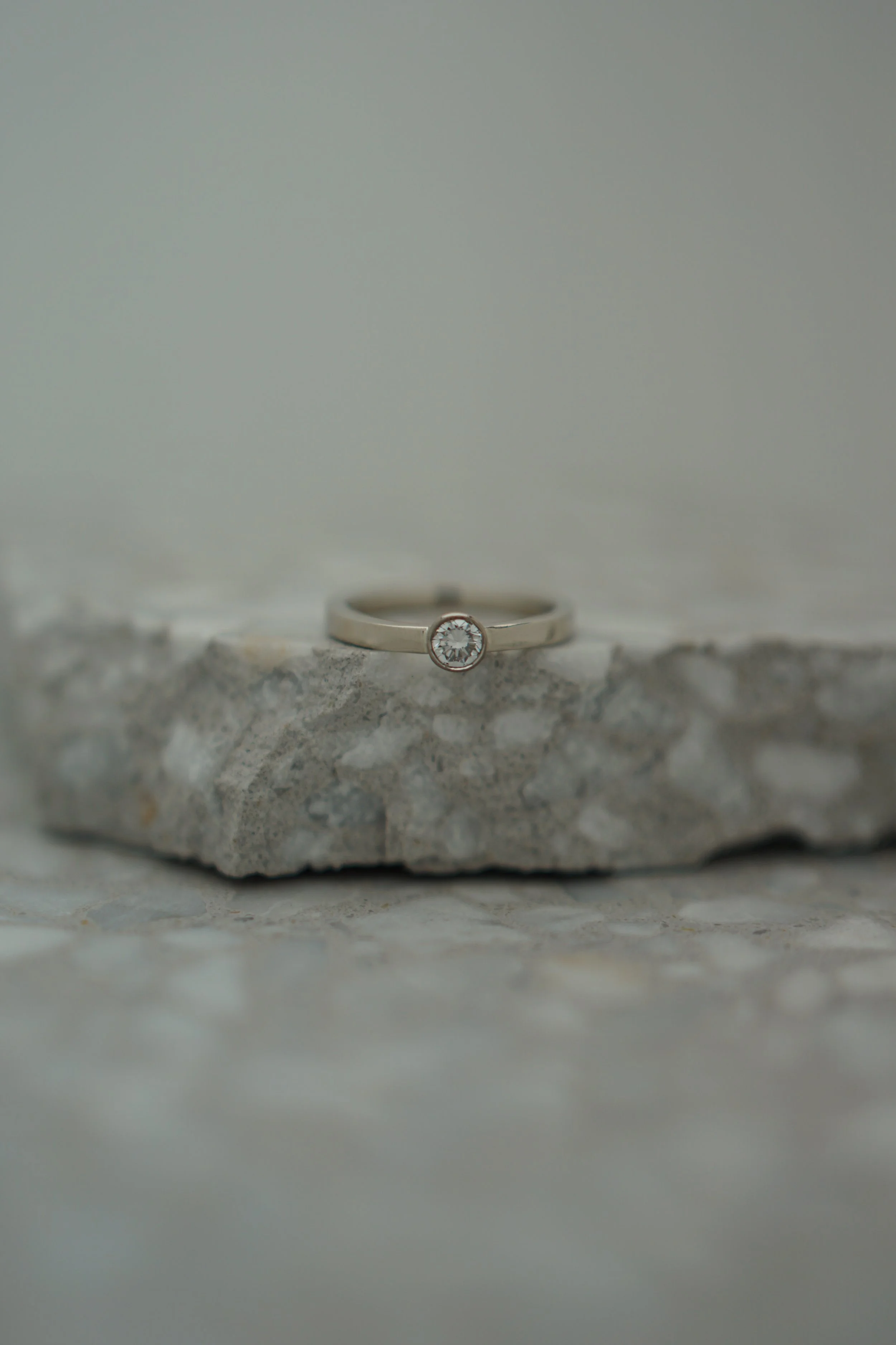 White gold and diamond, both recycled from original ring.