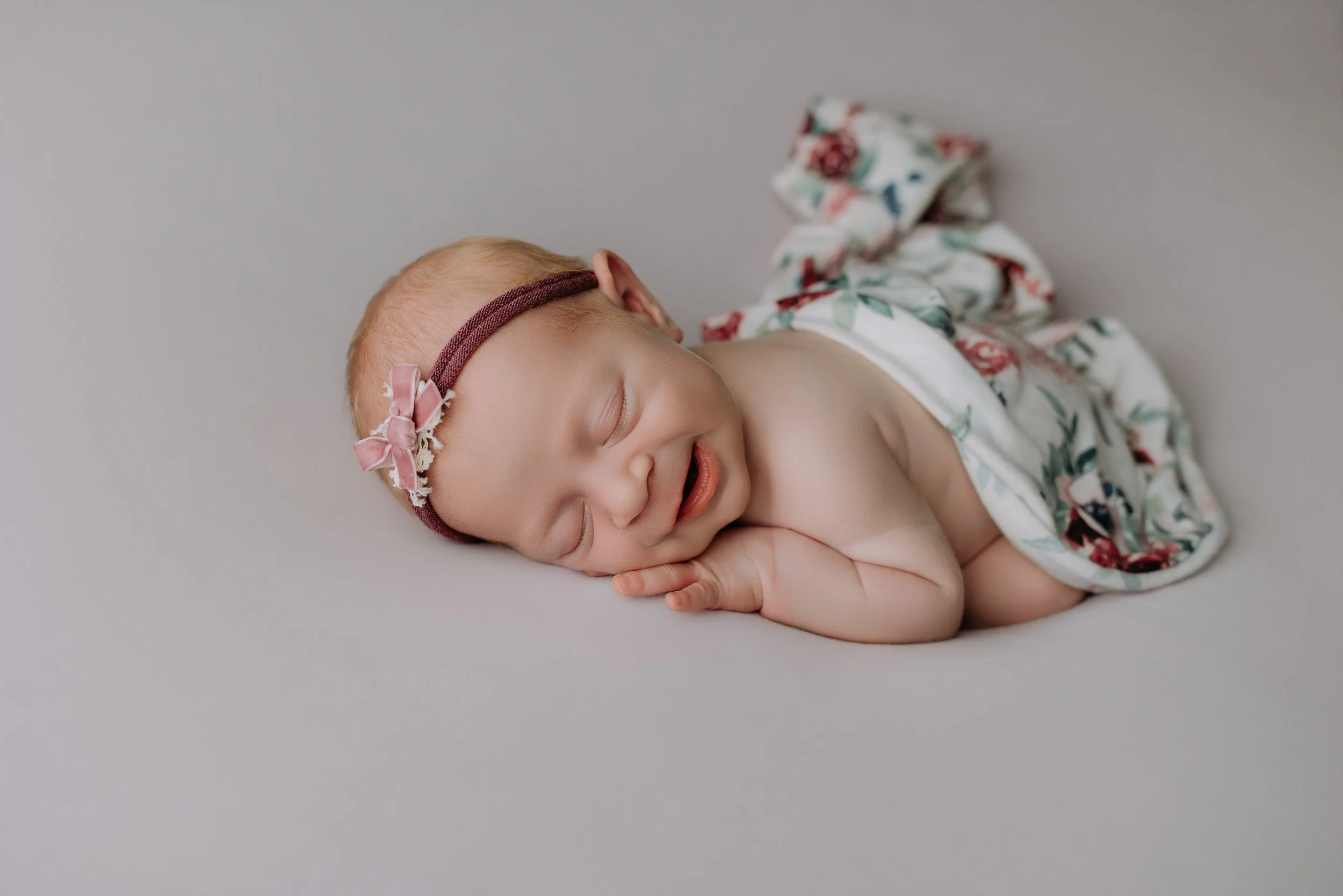 newborn-girl-viola-sleeping-prop-pose.jpg