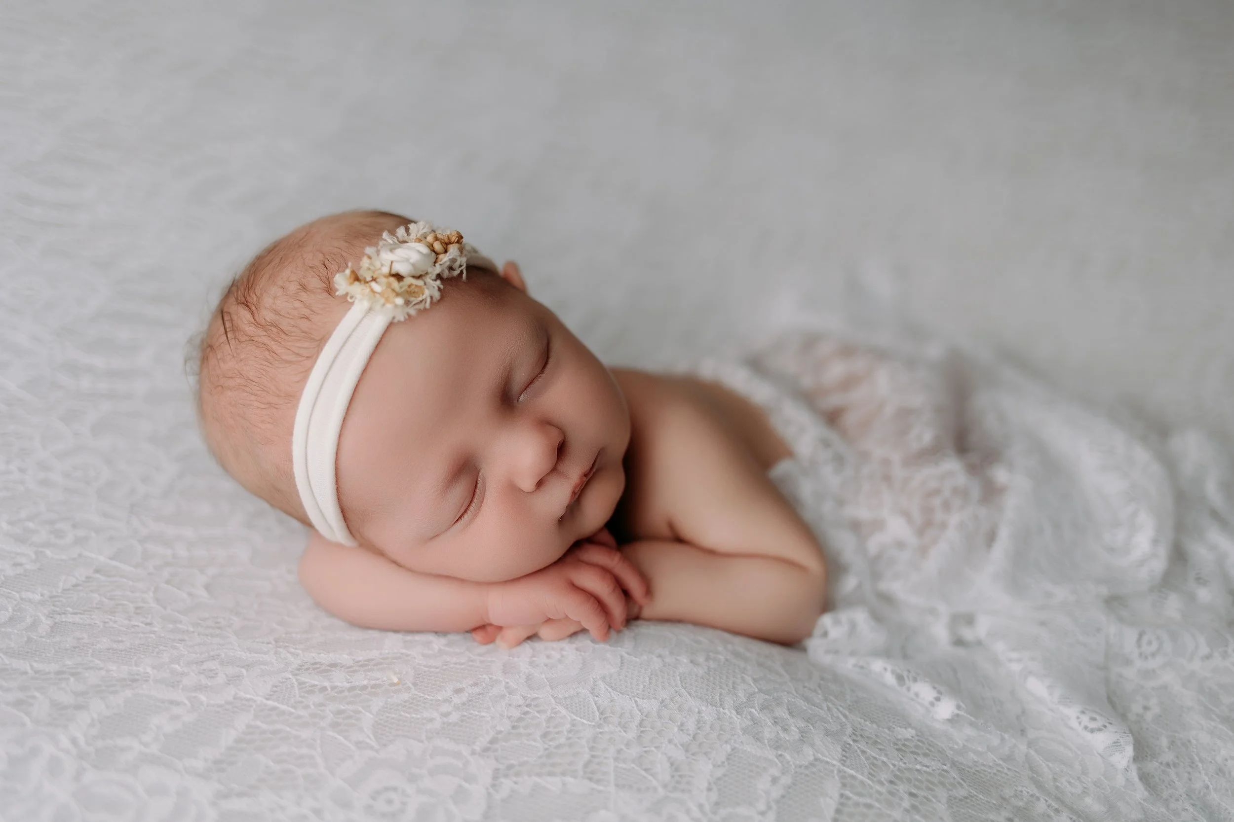 newborn-baby-girl-sleeping-blanket.jpg