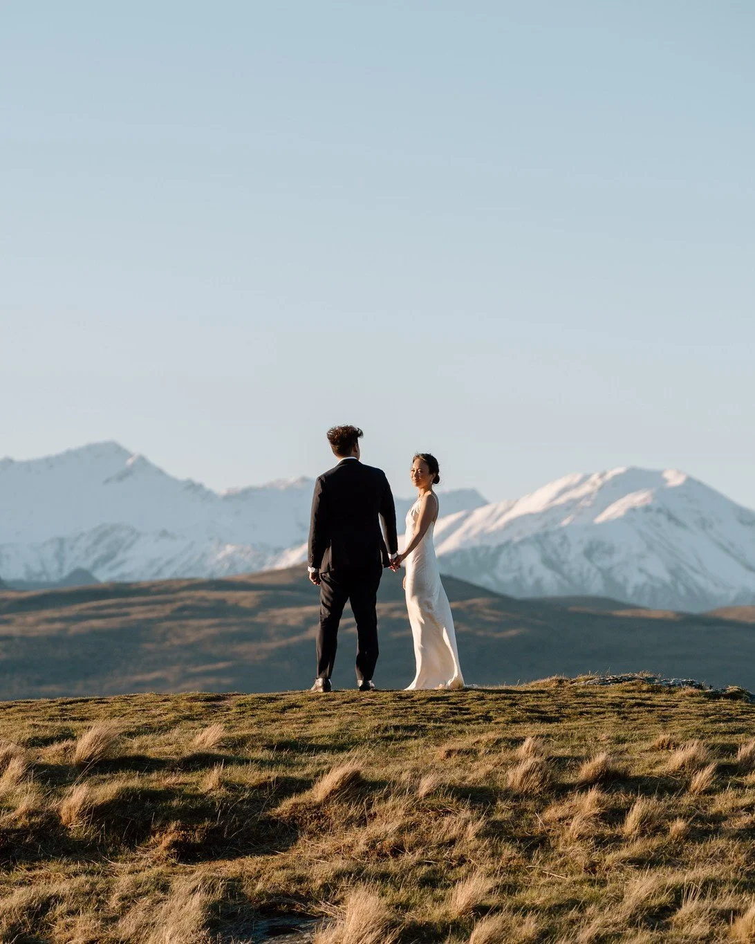The most magical place to elopement without the need for a helicopter 🤍 Only a short drive from town, Deer Park Heights offers some of the best views of Remarkables and Lake Wakatipu 
.
.
.
#nzweddingphotographer #nzwedding #nzweddings #newzealandel