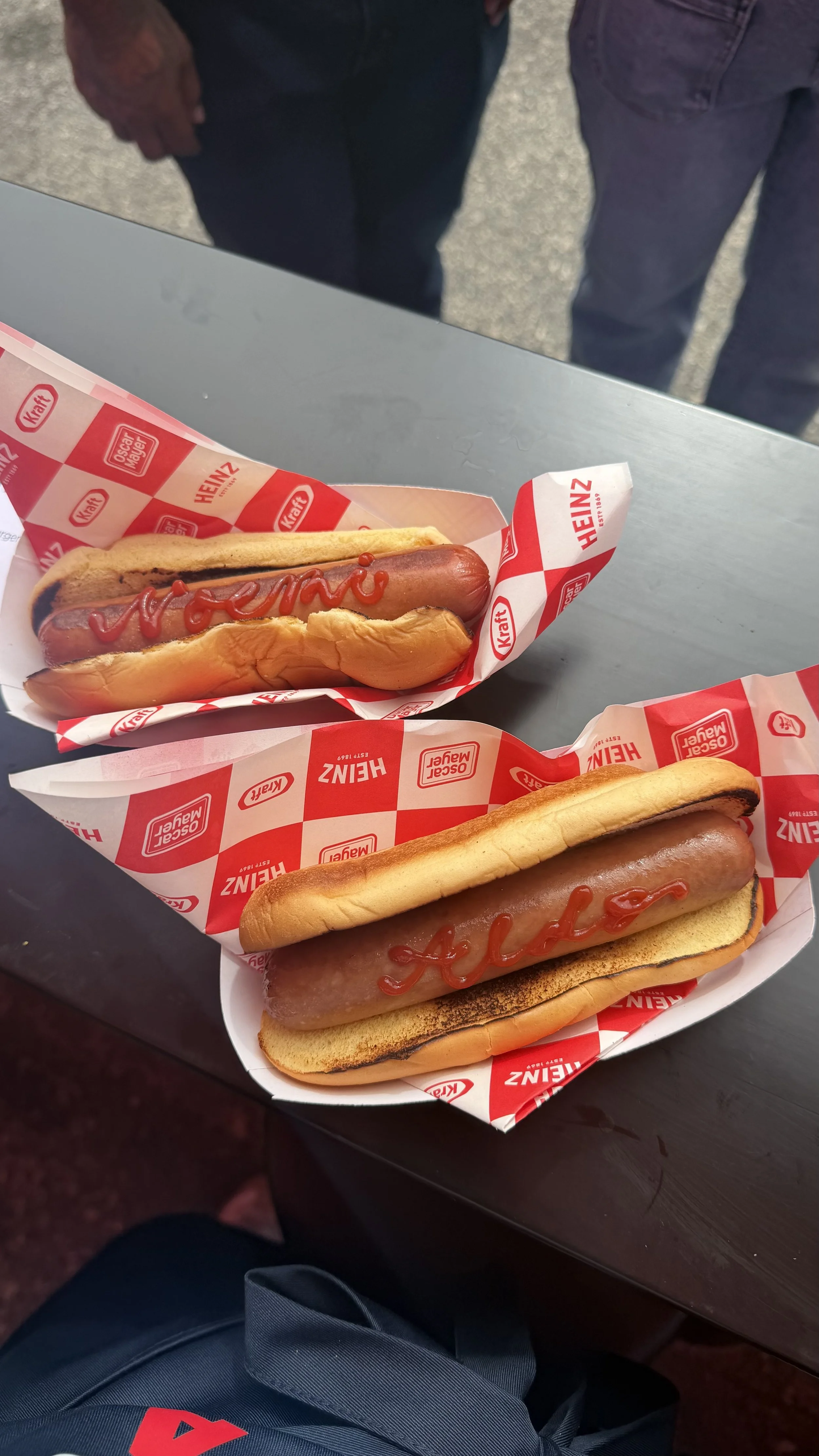 Ketchup calligraphy on hot dogs for Heinz brand activation at Fourth of July celebration for America250 in Los Angeles, CA