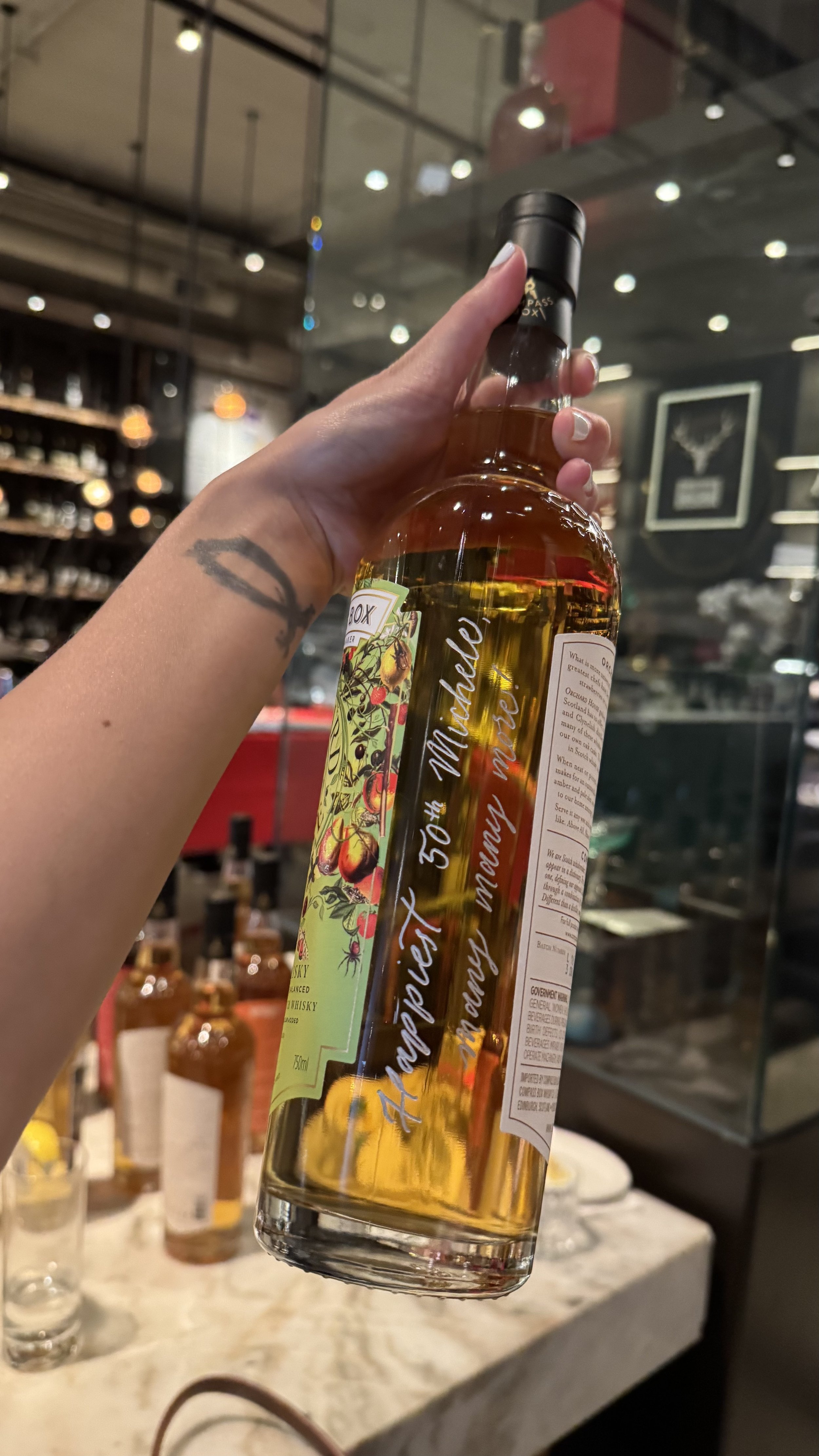 Whiskey Engraving Brand Activation for Compass Box Whisky Tasting Event for Influencers Los Angeles Wallys Santa Monica Engraving Calligraphy Artist Stacy Shon bottle engraver etching glass liquor calligrapher.jpeg